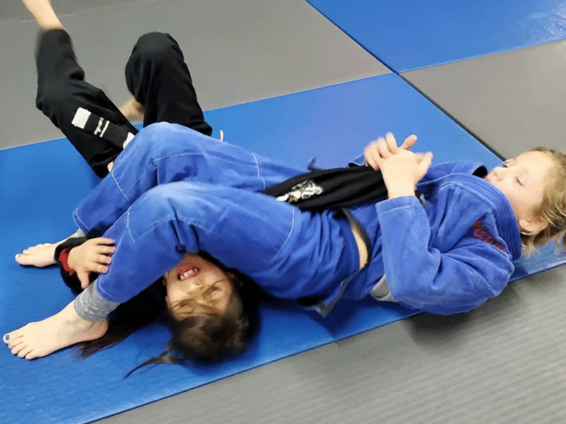 a woman holding a man on her back