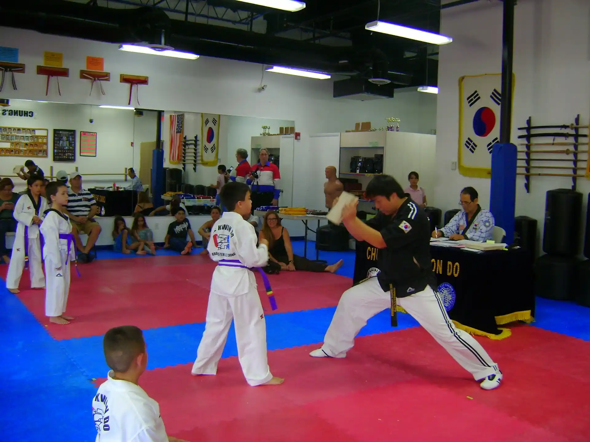 a group of people in a karate class