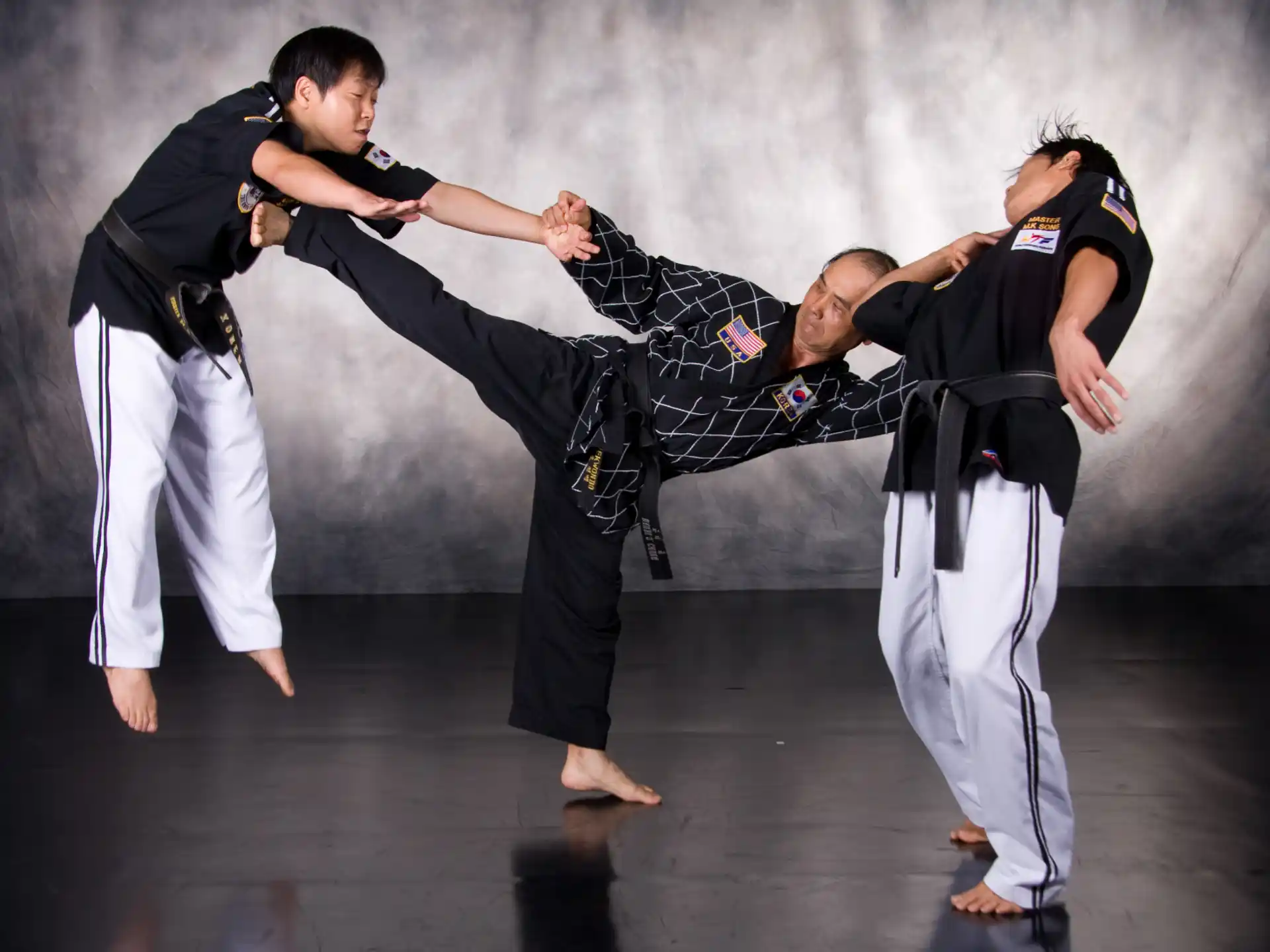 a group of people in martial arts uniforms