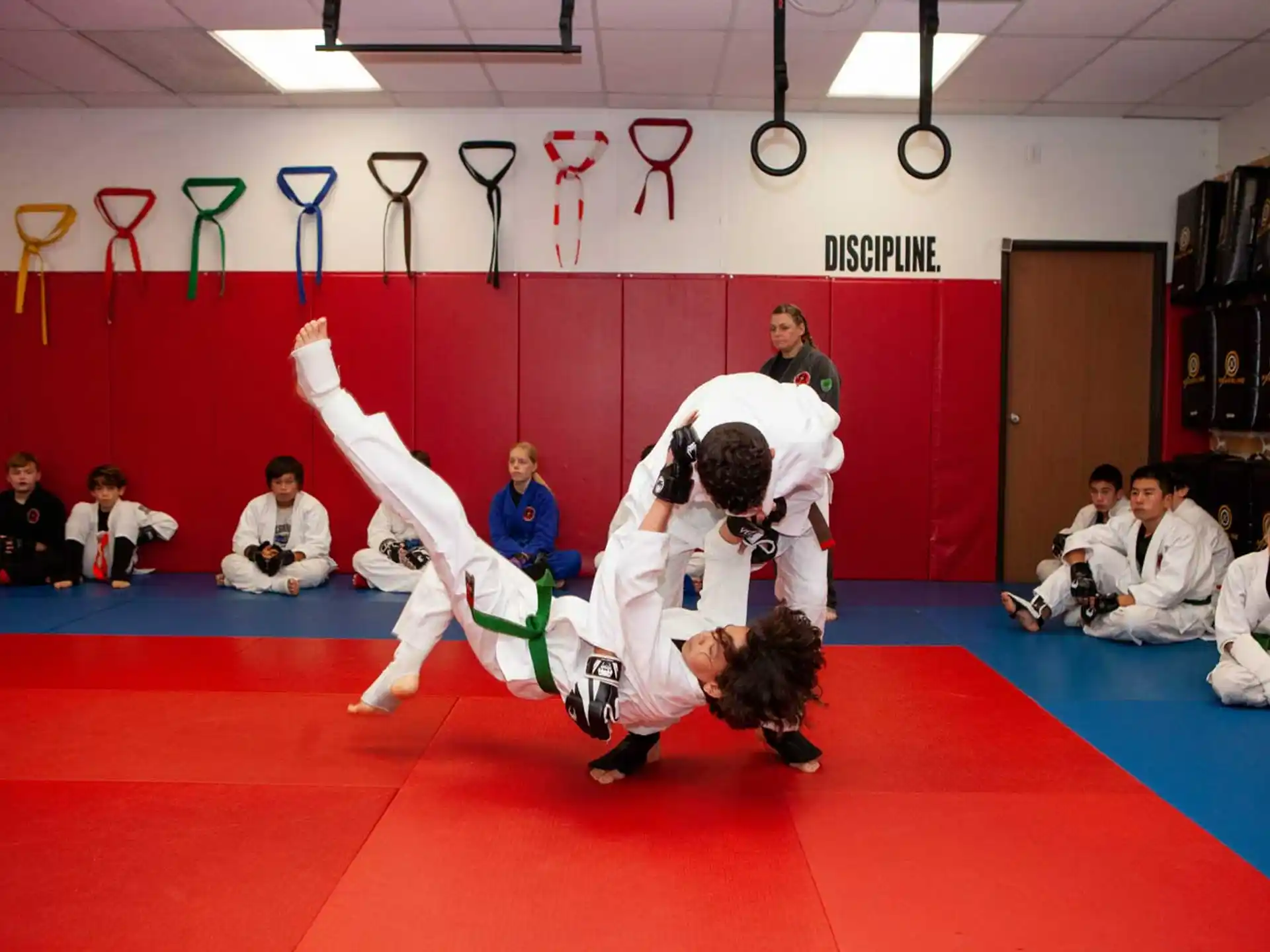 a group of people in a karate class