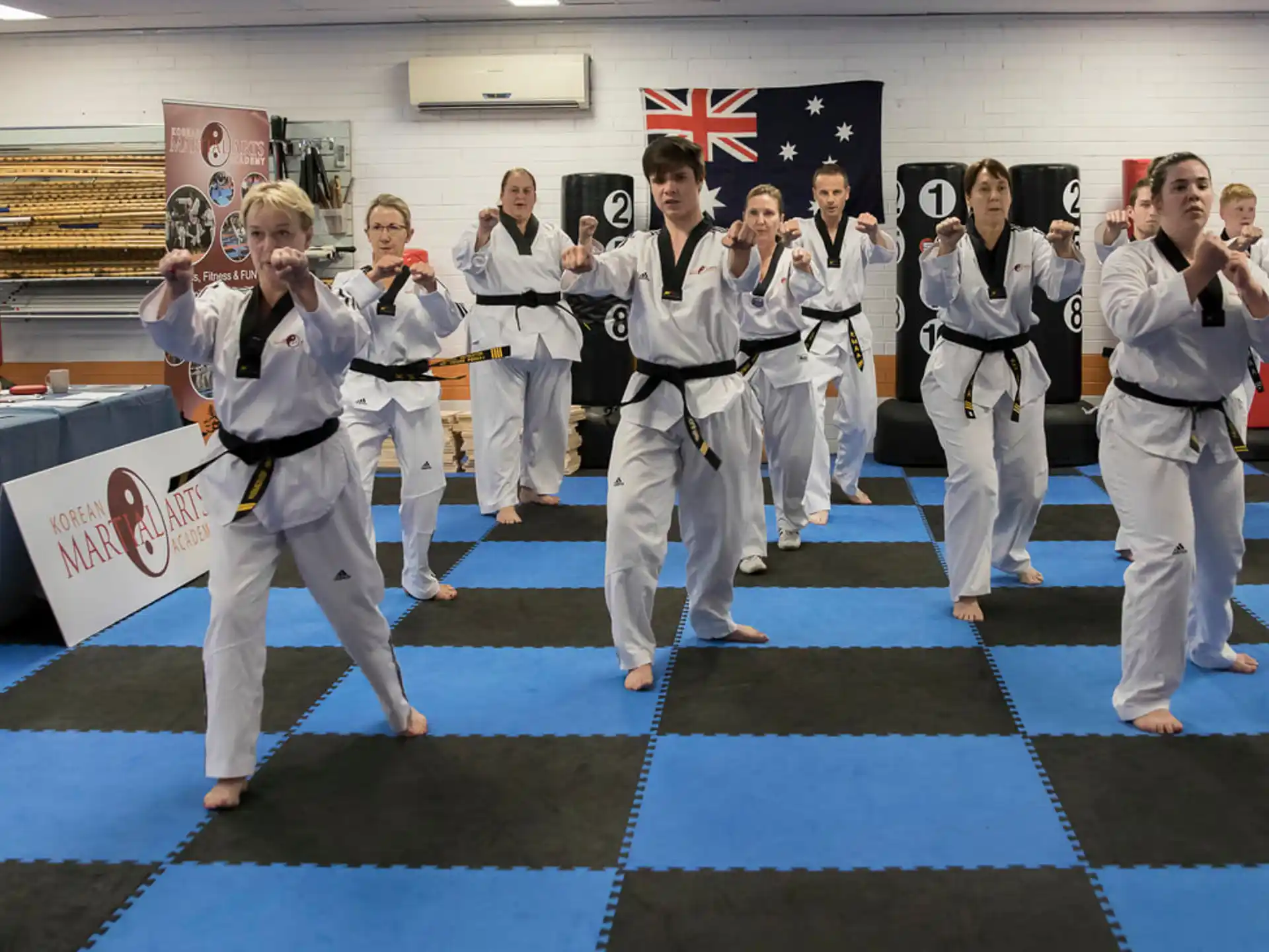 a group of people in karate uniforms