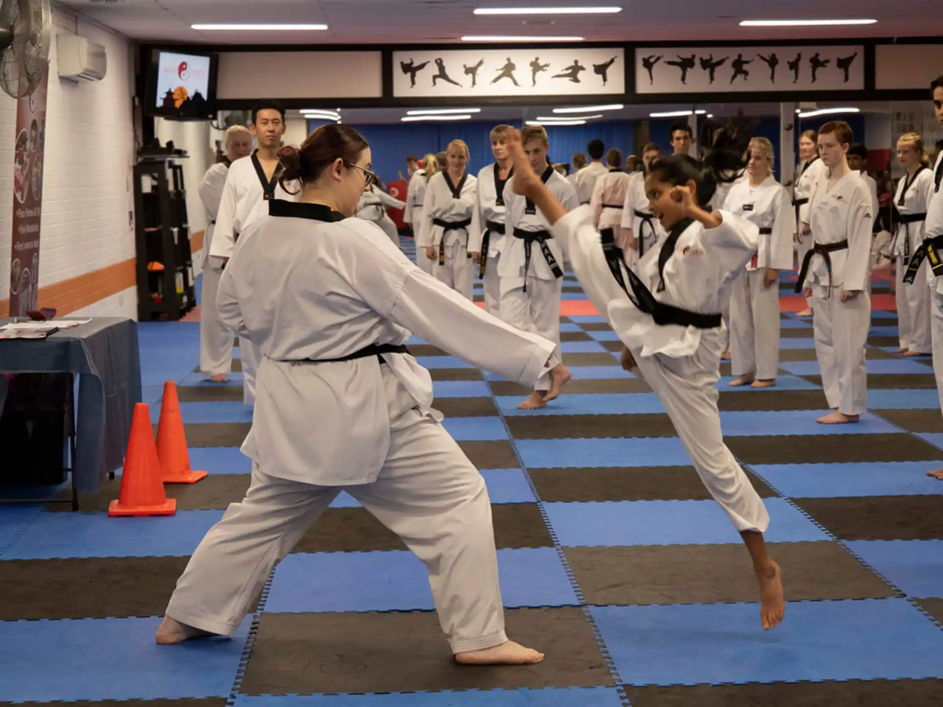 a group of people in karate uniforms
