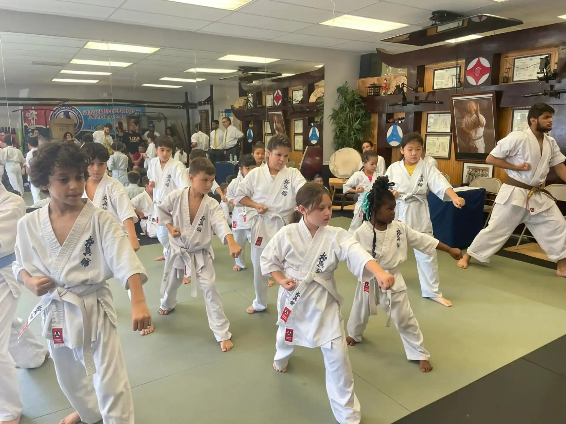 a group of people in karate uniforms