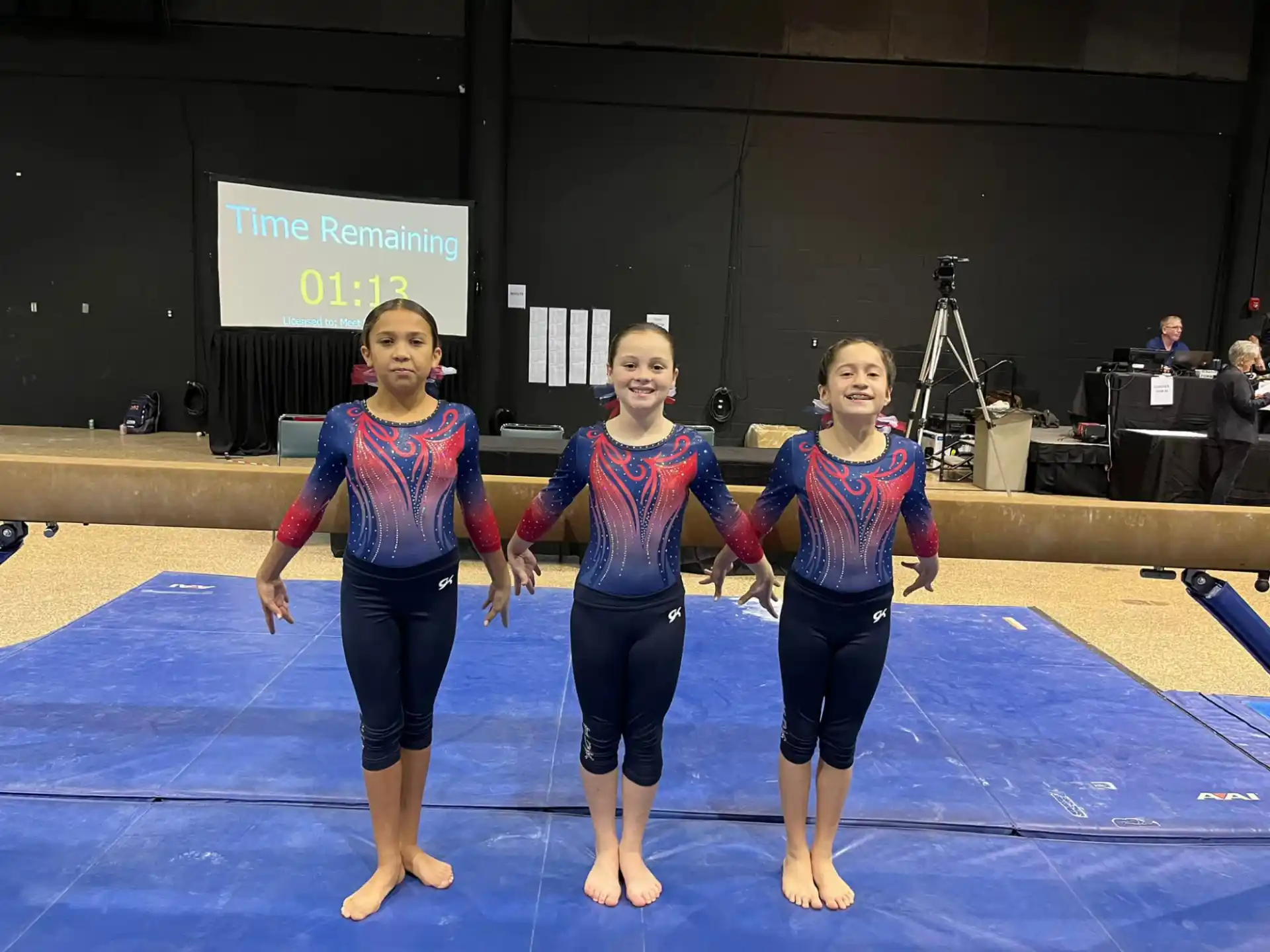 a group of girls in leotards on a stage