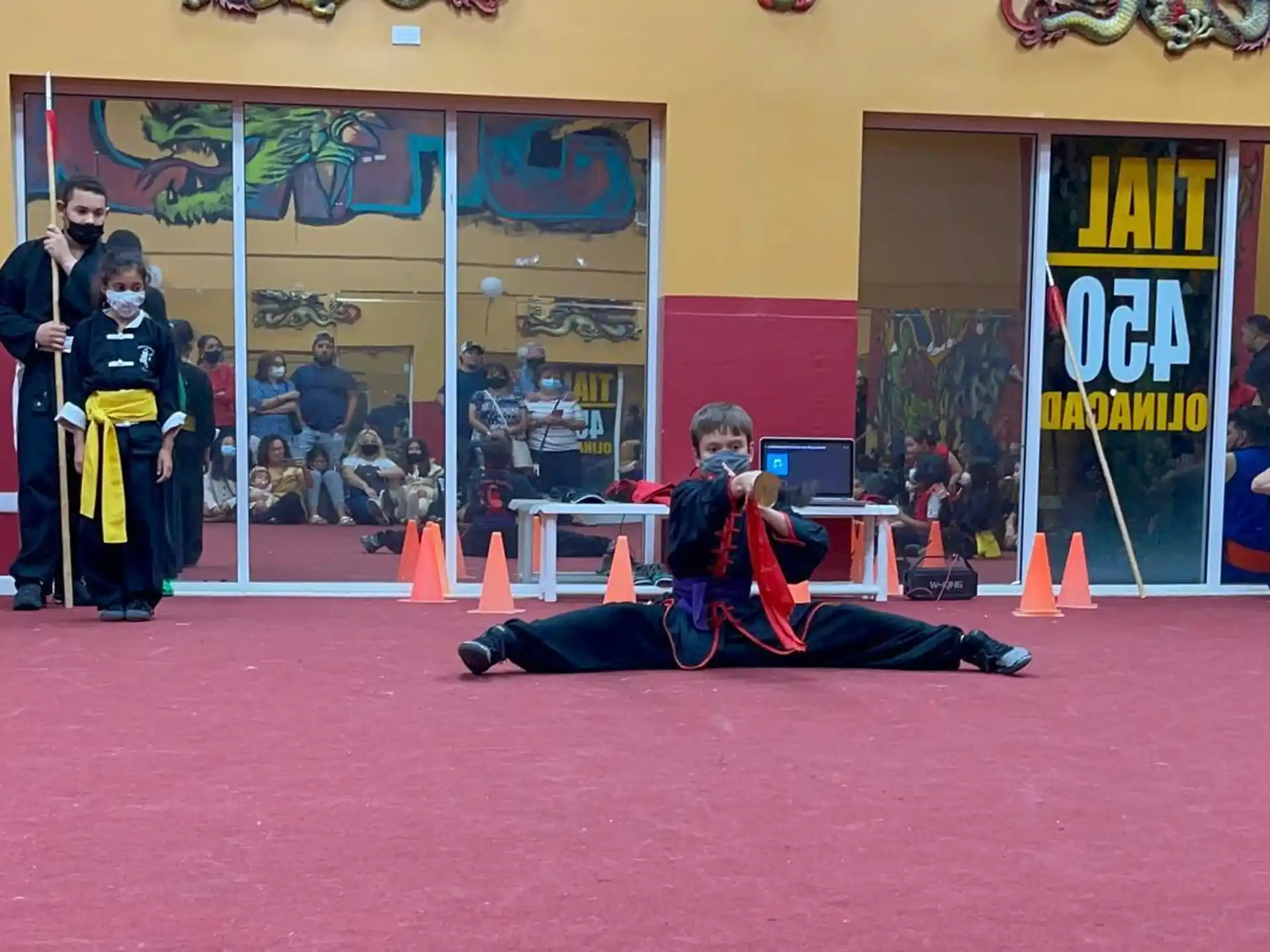 a person lying on the ground with a person standing behind him