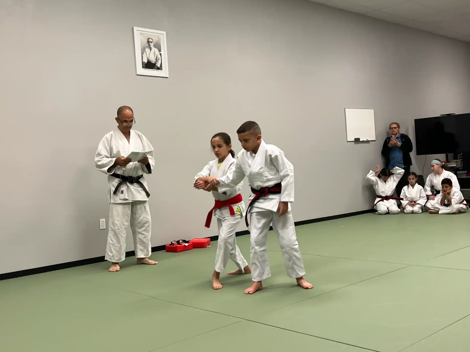 a group of people in karate uniforms