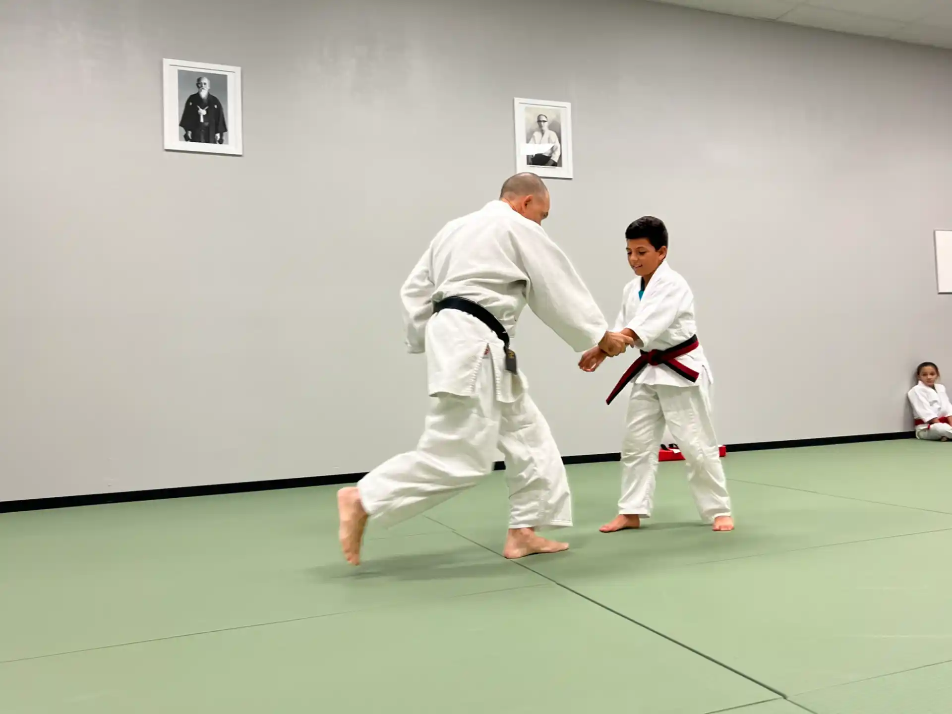 a man and a boy in karate uniforms