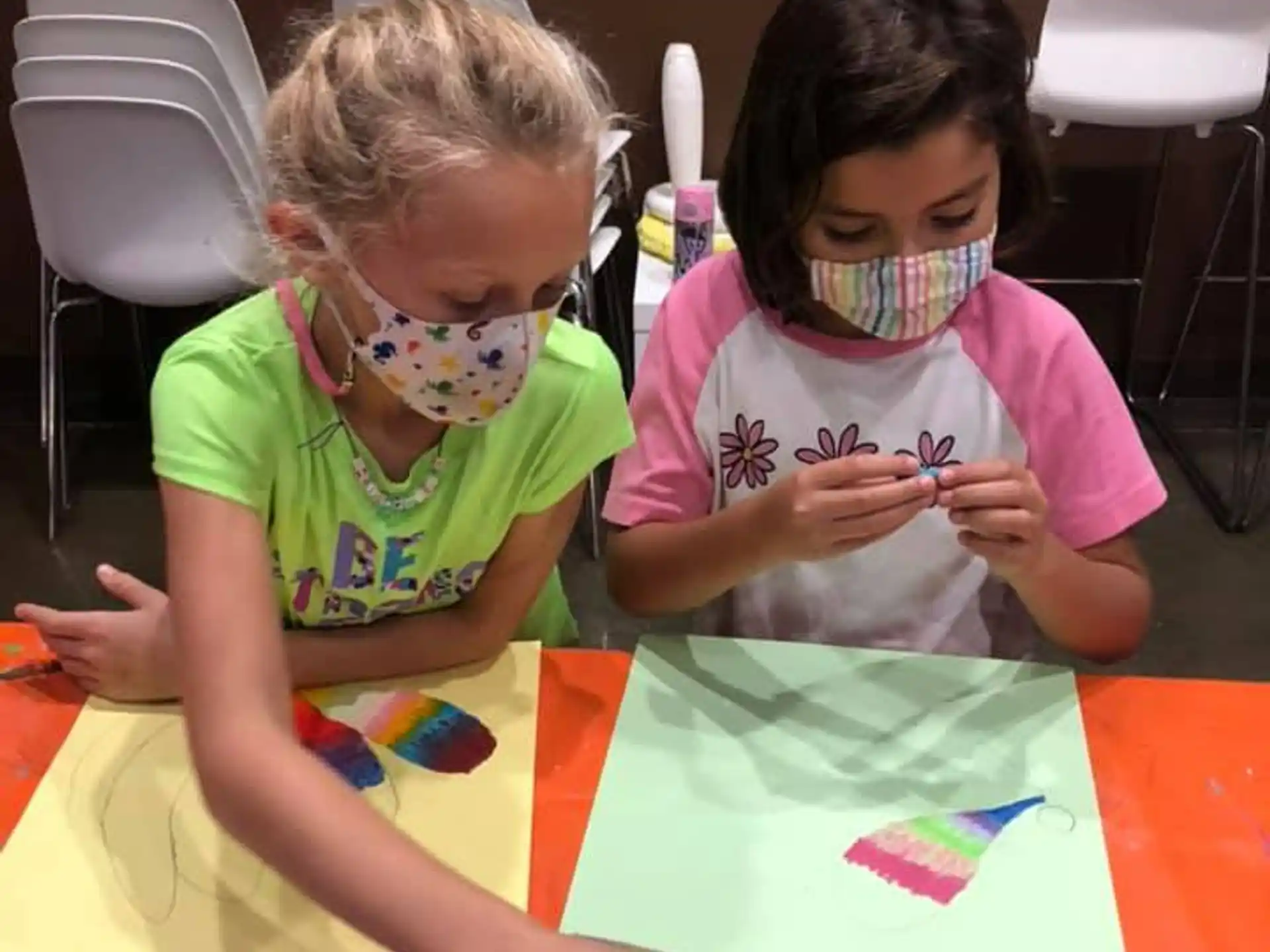 a couple of young girls painting