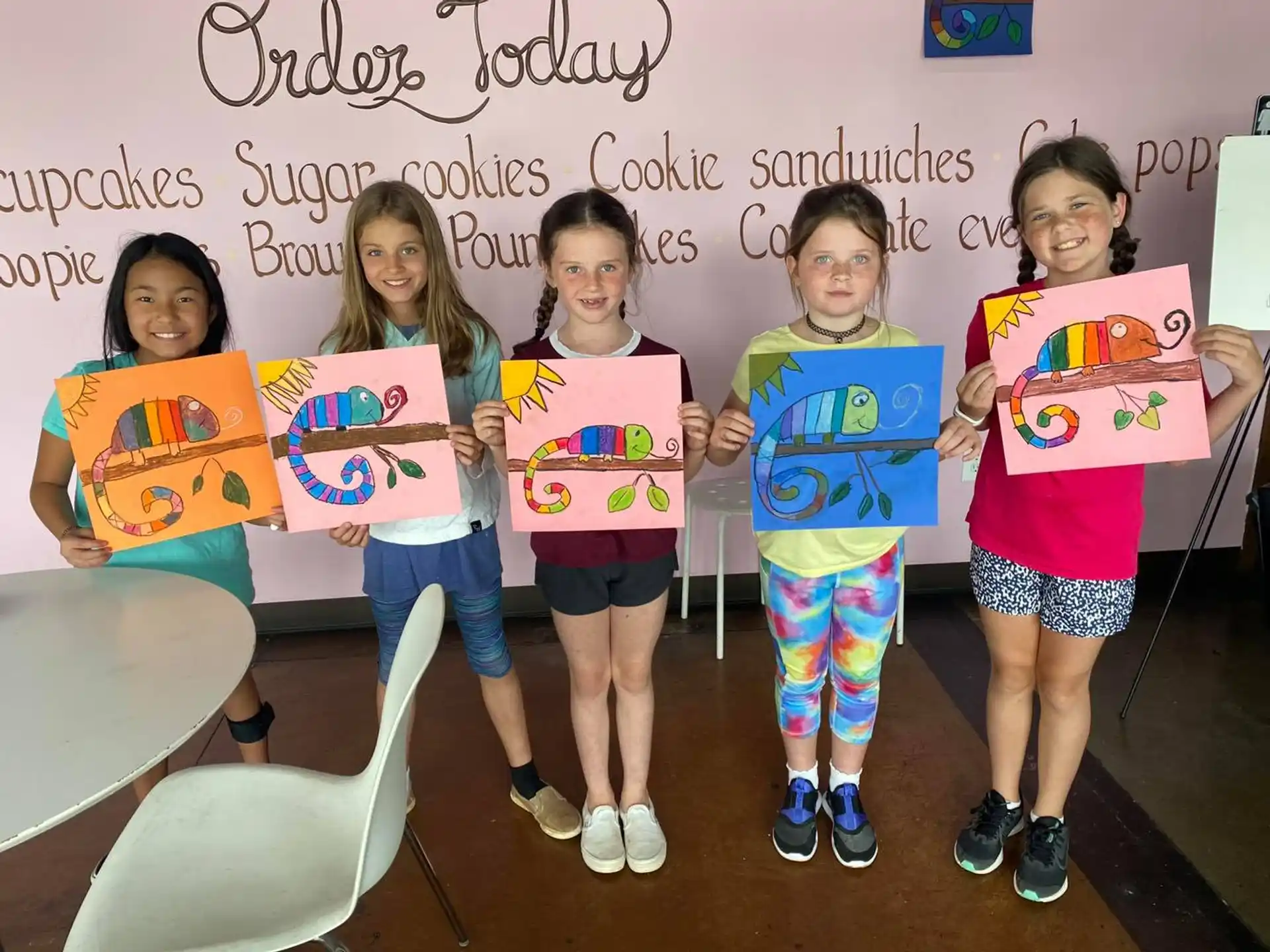 a group of girls holding signs