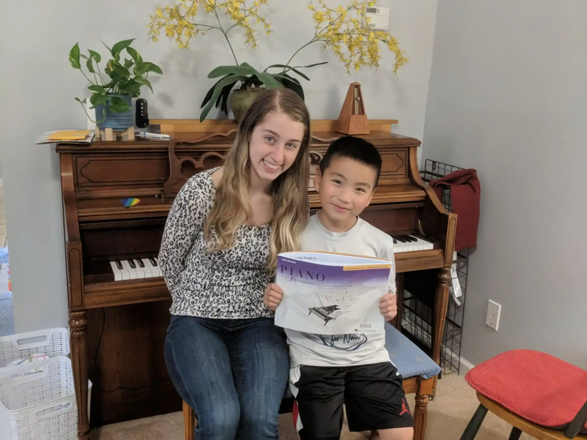 a woman and a boy posing for a picture