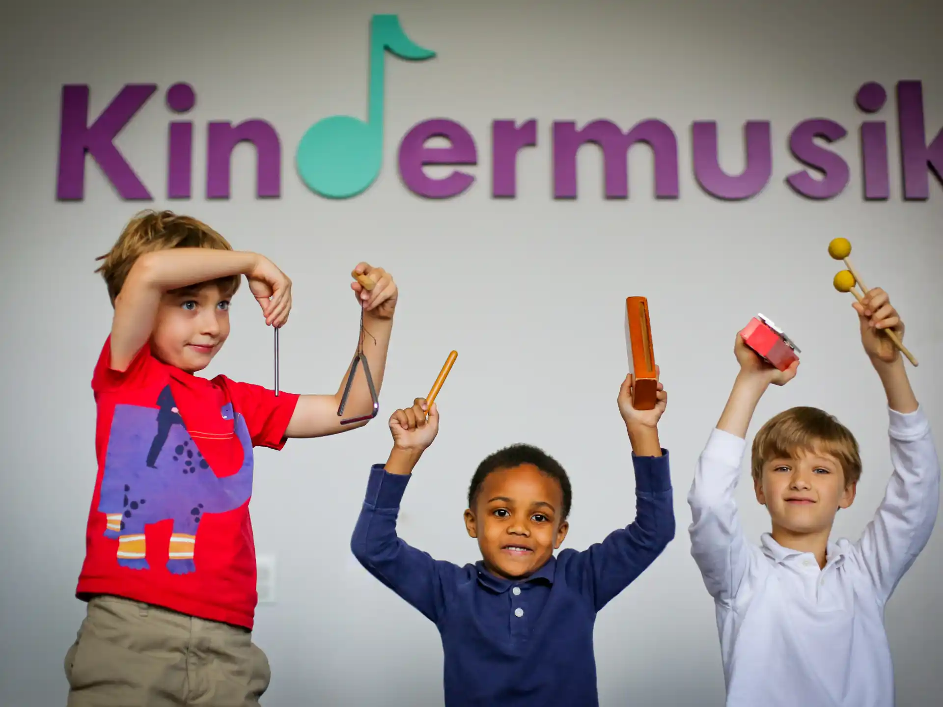 a group of boys holding objects