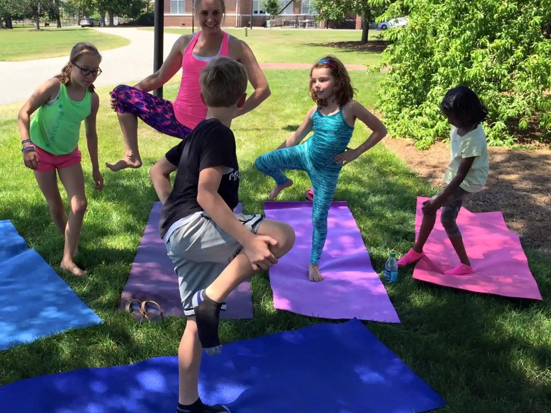 a group of people on mats