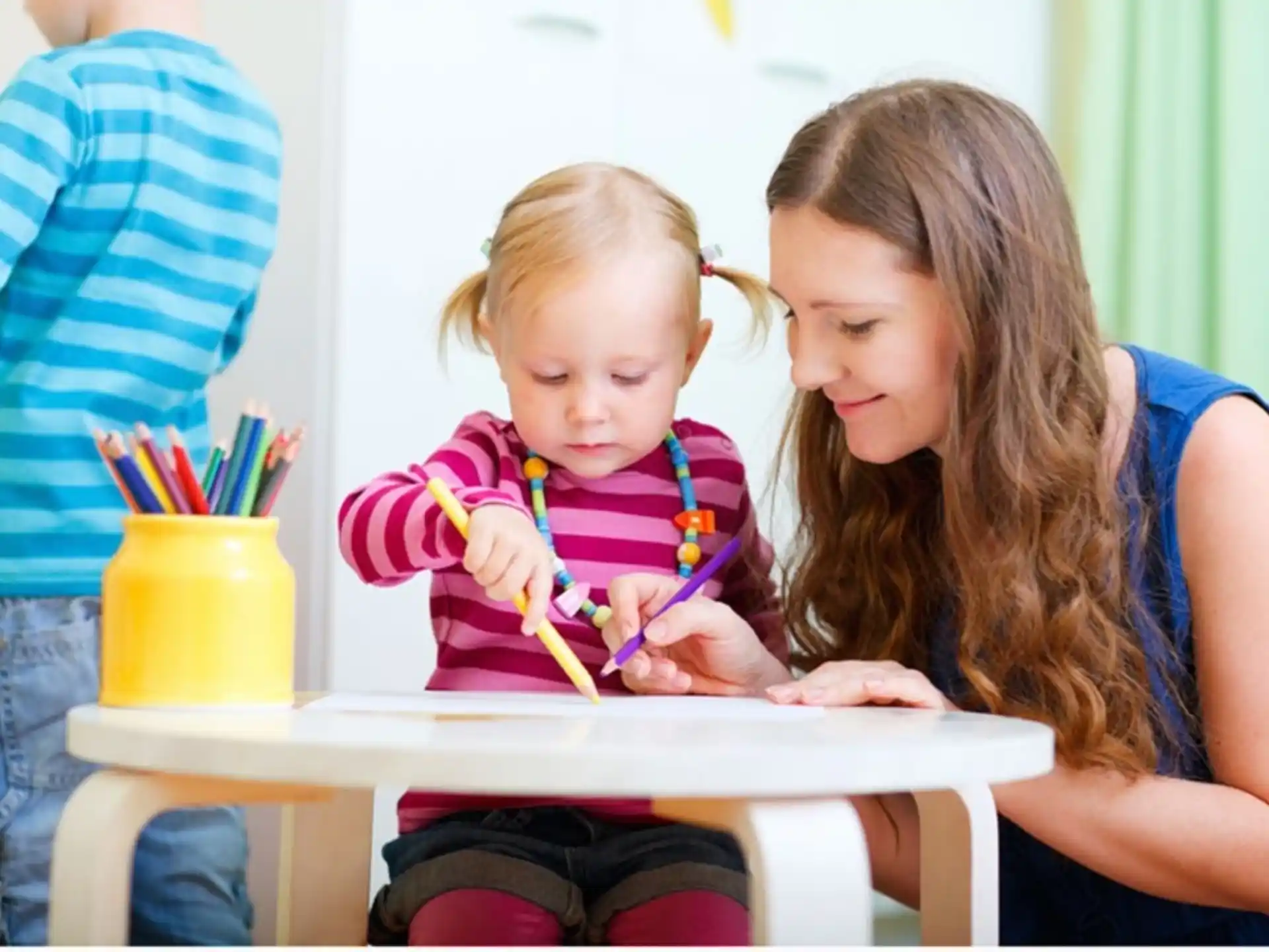 a person and a child painting