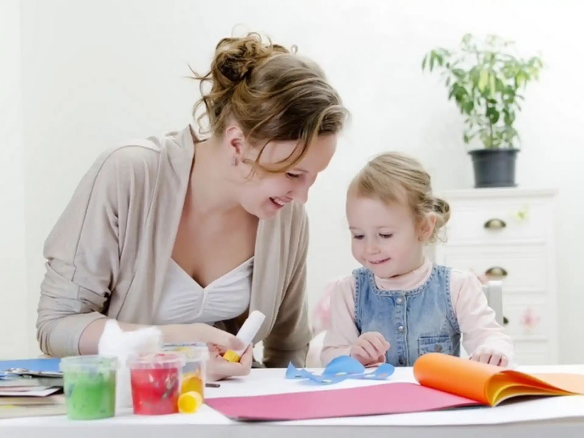 a person and a child painting