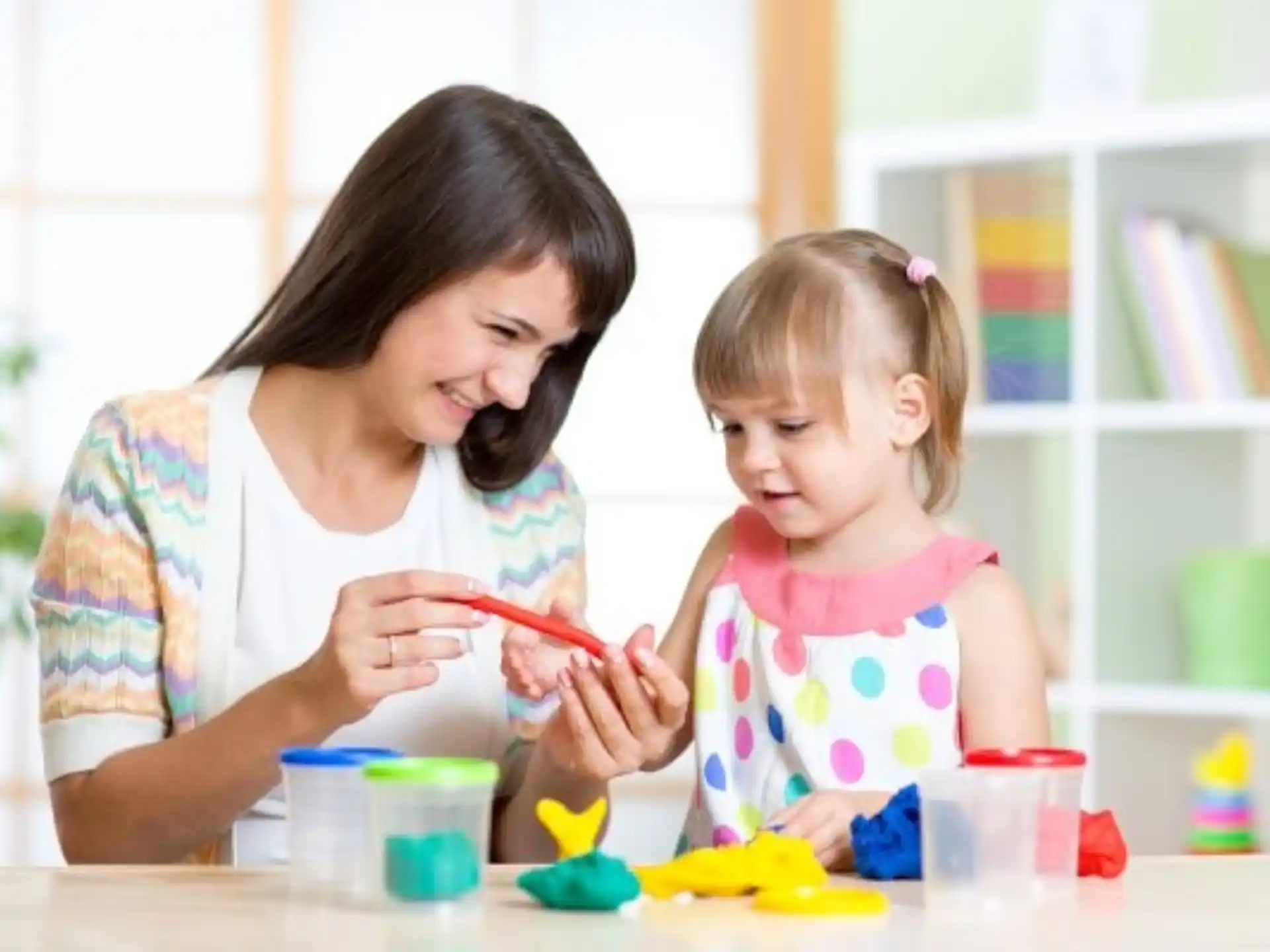 a person and a child painting
