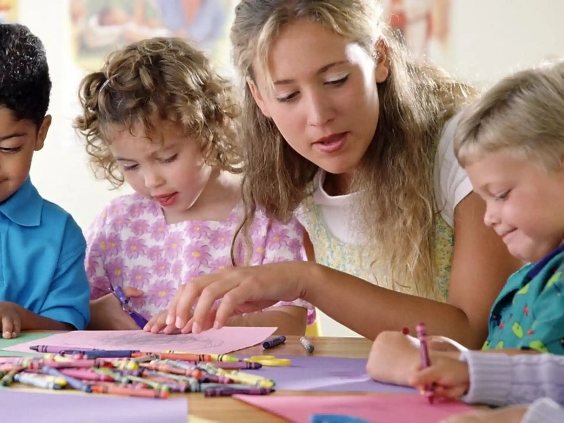 a group of children sitting at a table