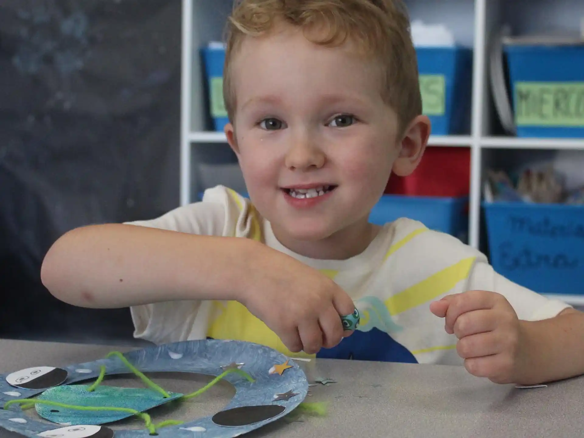 a boy sitting at a table
