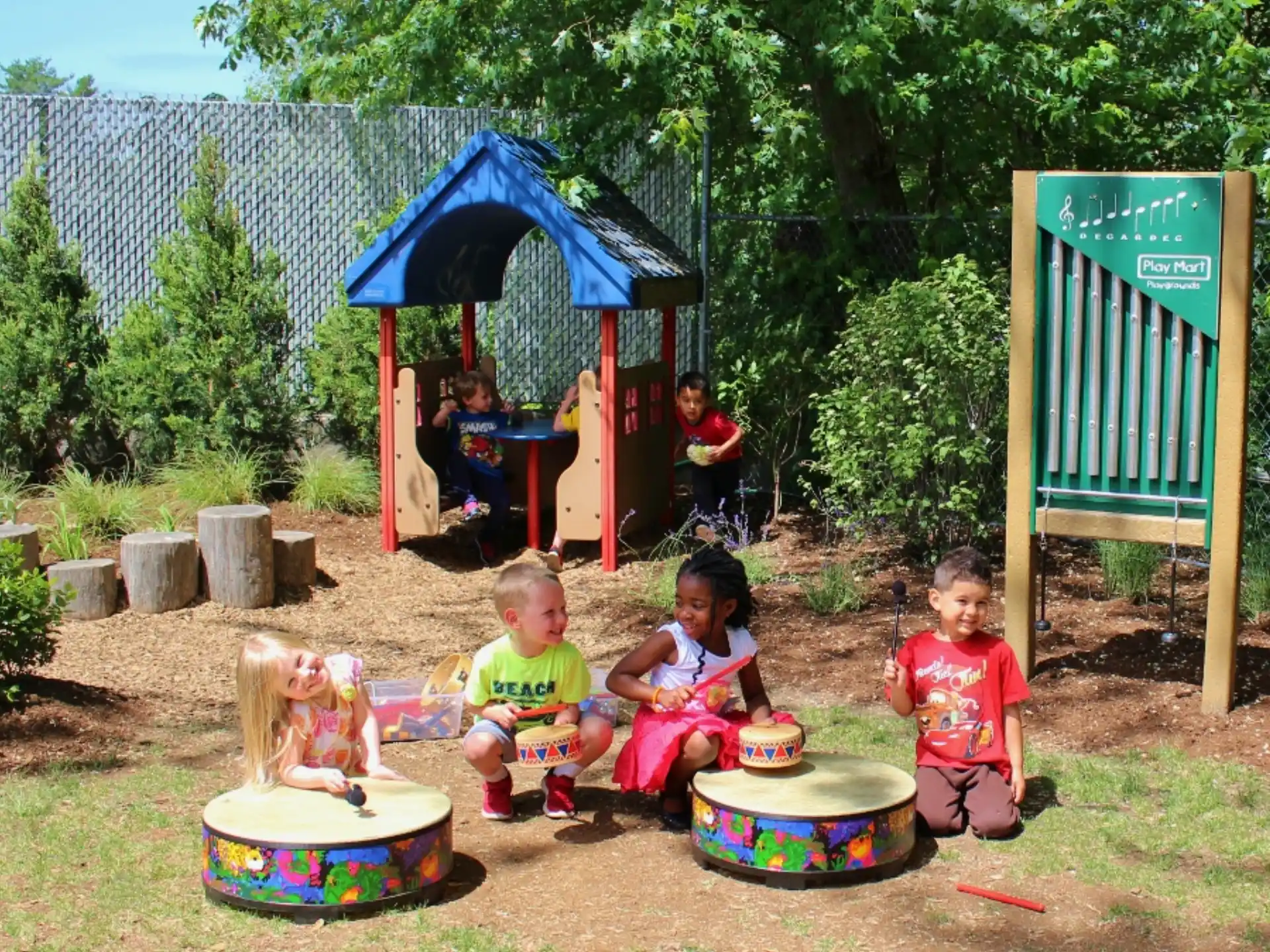 children sitting in a play area