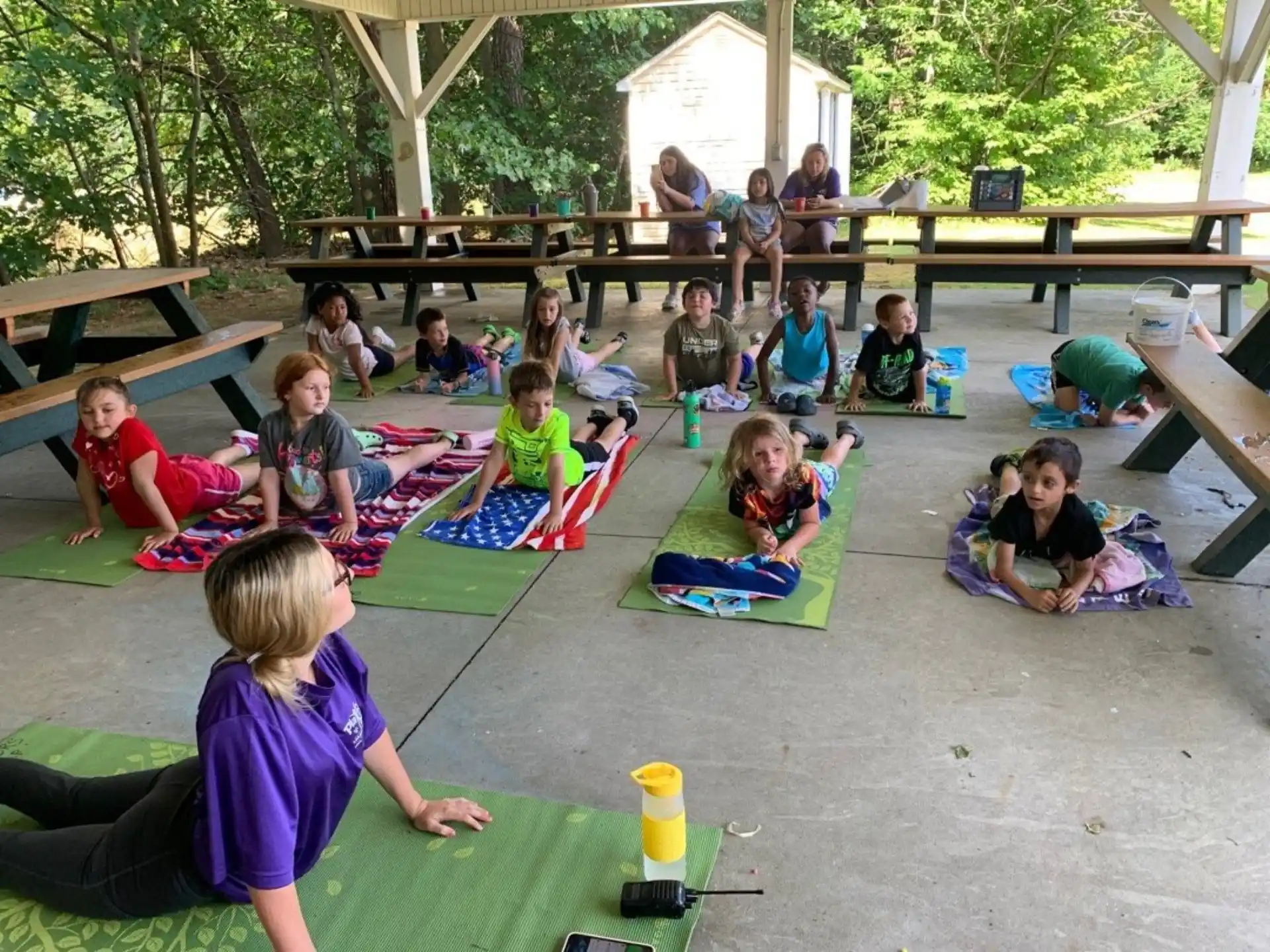 a group of children sitting on the ground