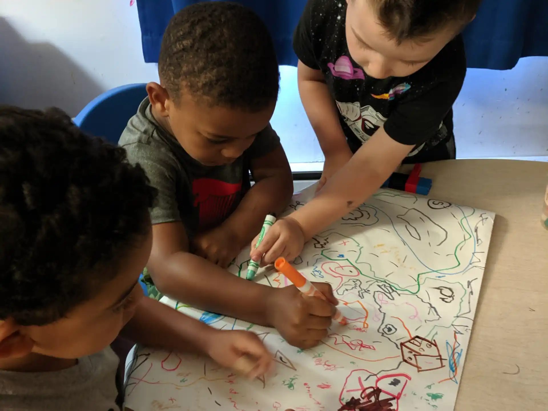 a group of children playing with a puzzle