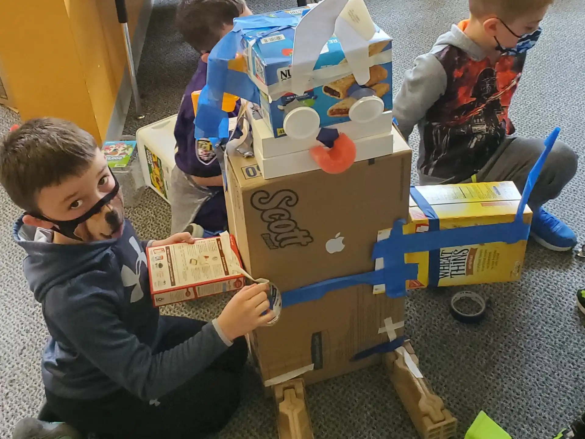 a few boys playing with building blocks