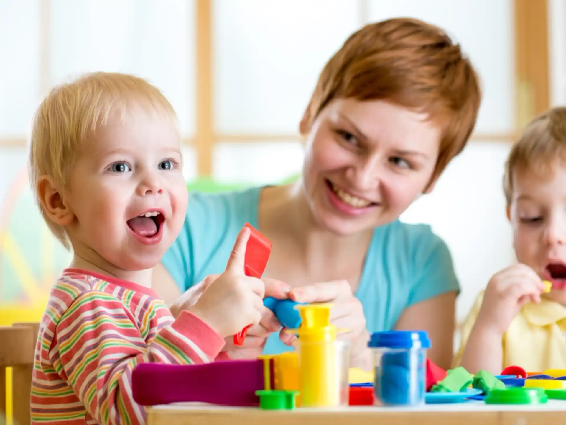 a group of kids playing with toys