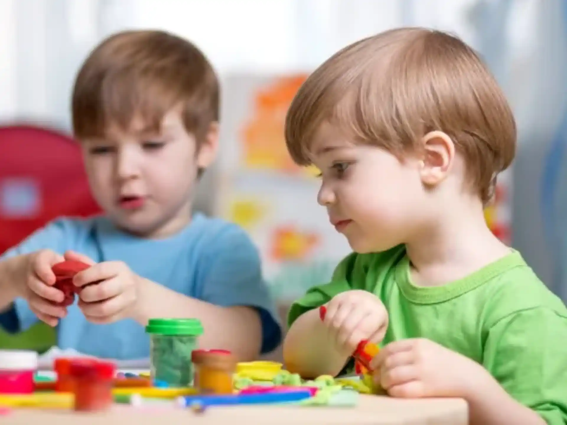 a couple of boys playing with toys