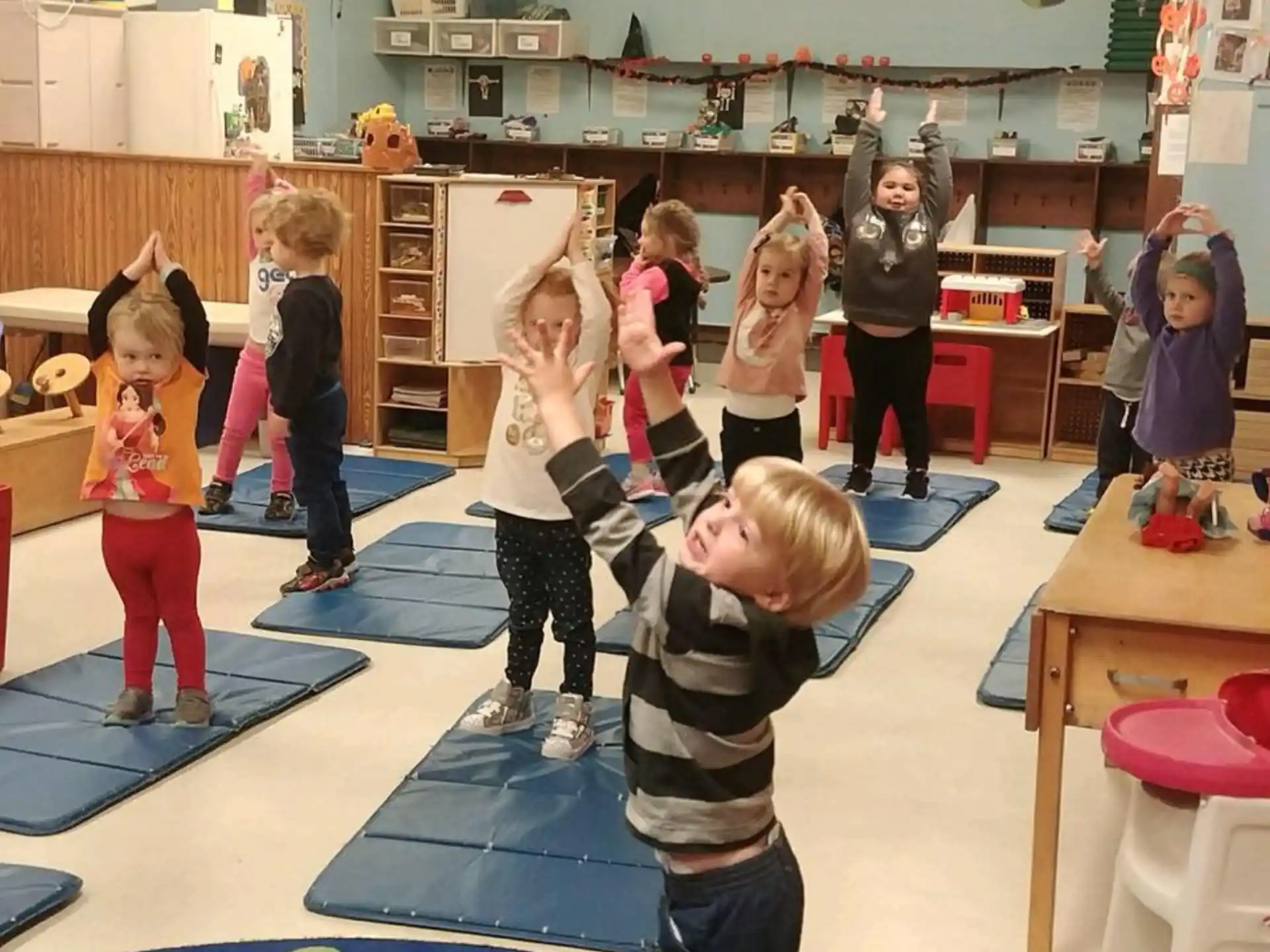 a group of children in a classroom