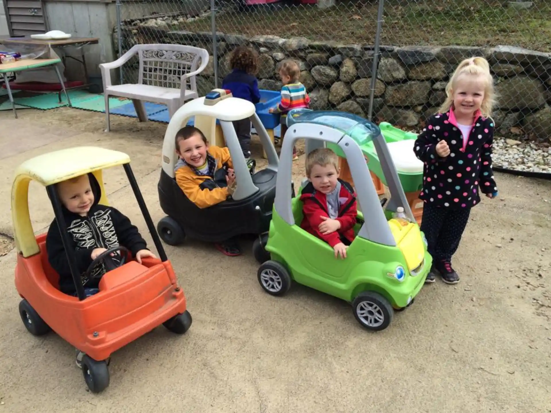a group of children in strollers