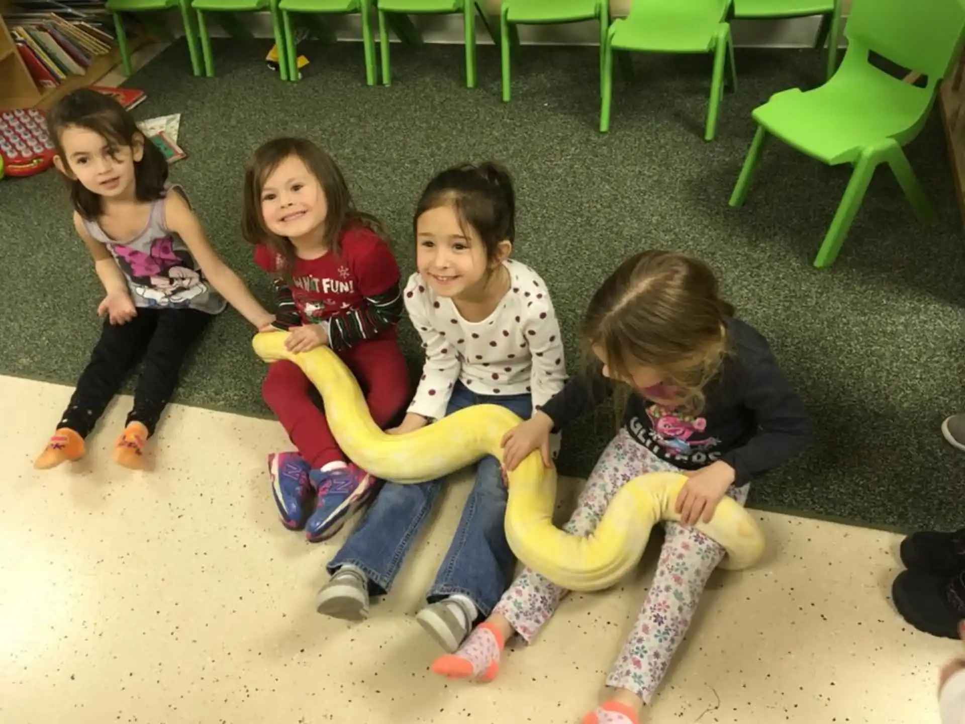 a group of children sitting on the floor