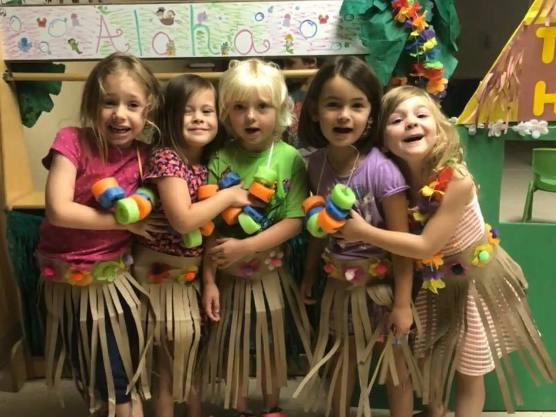 a group of girls posing for a photo