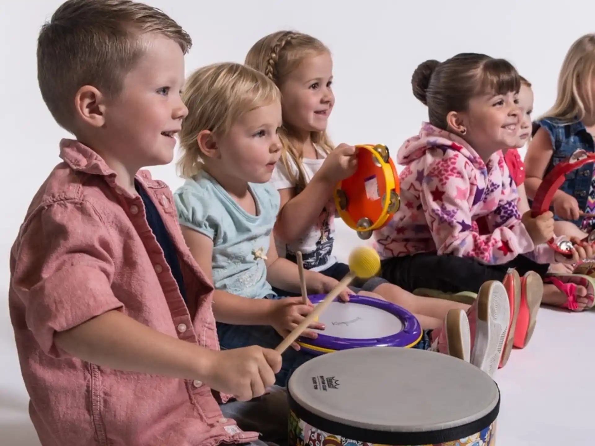 a group of children playing with toys