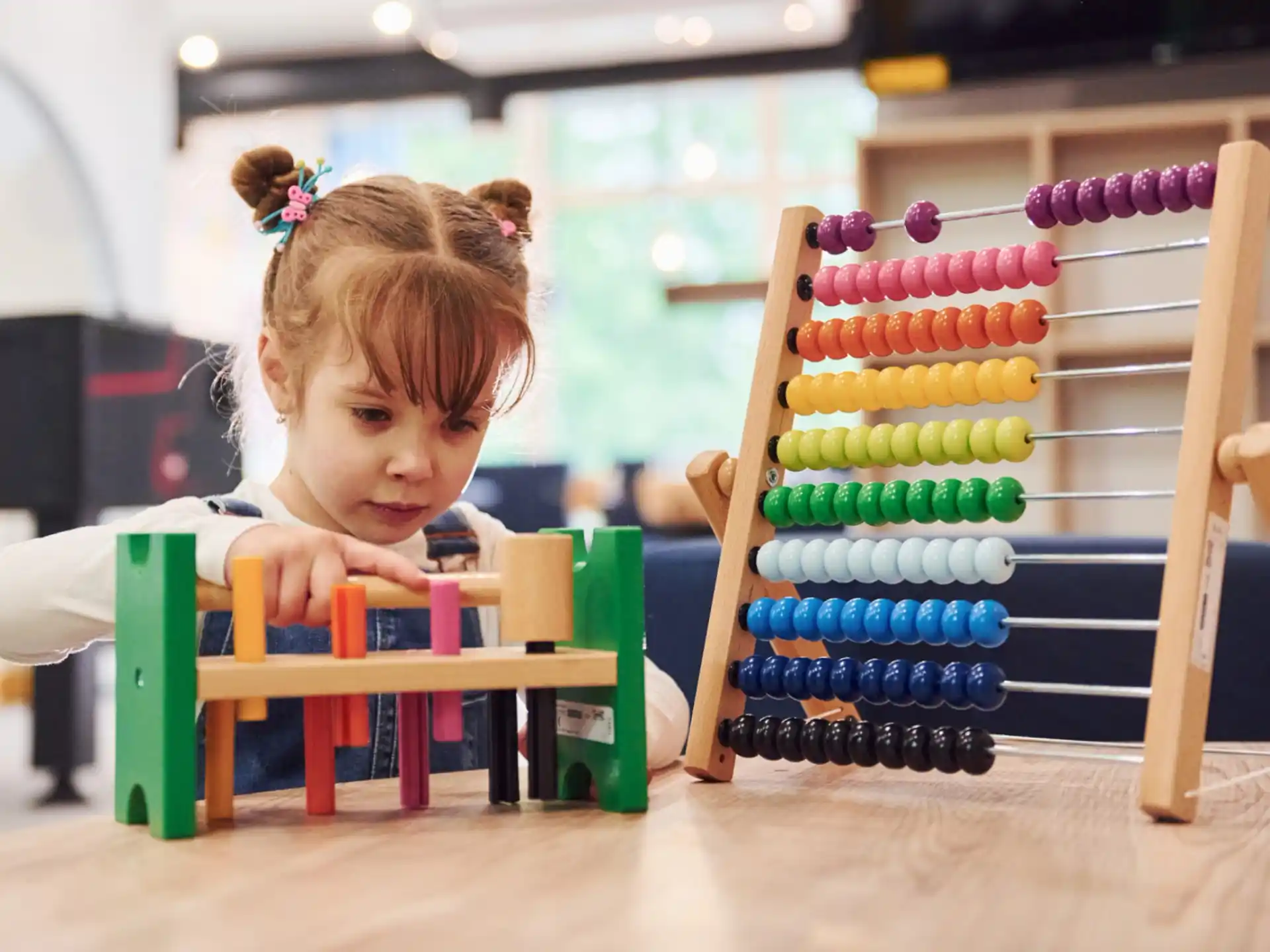 a girl playing with toys