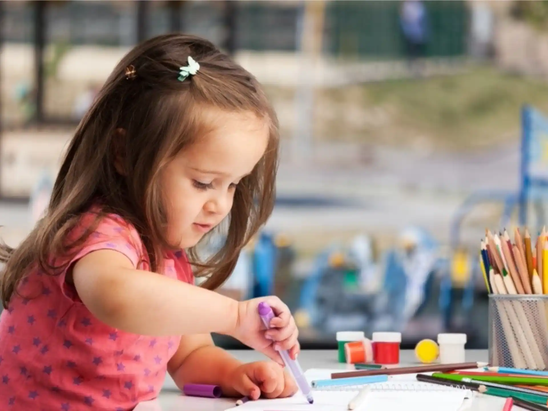 a young girl painting