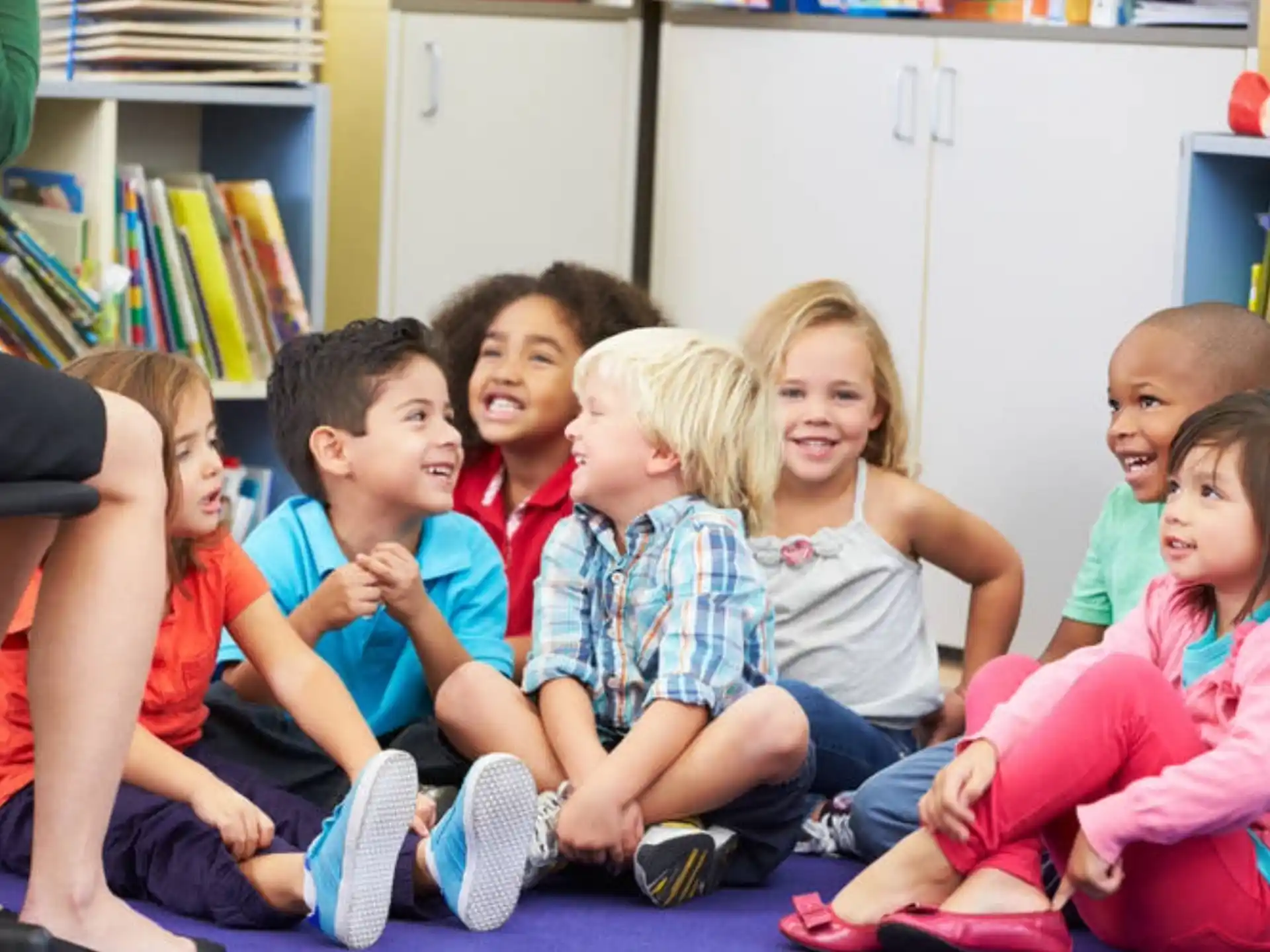 a group of children sitting on the floor