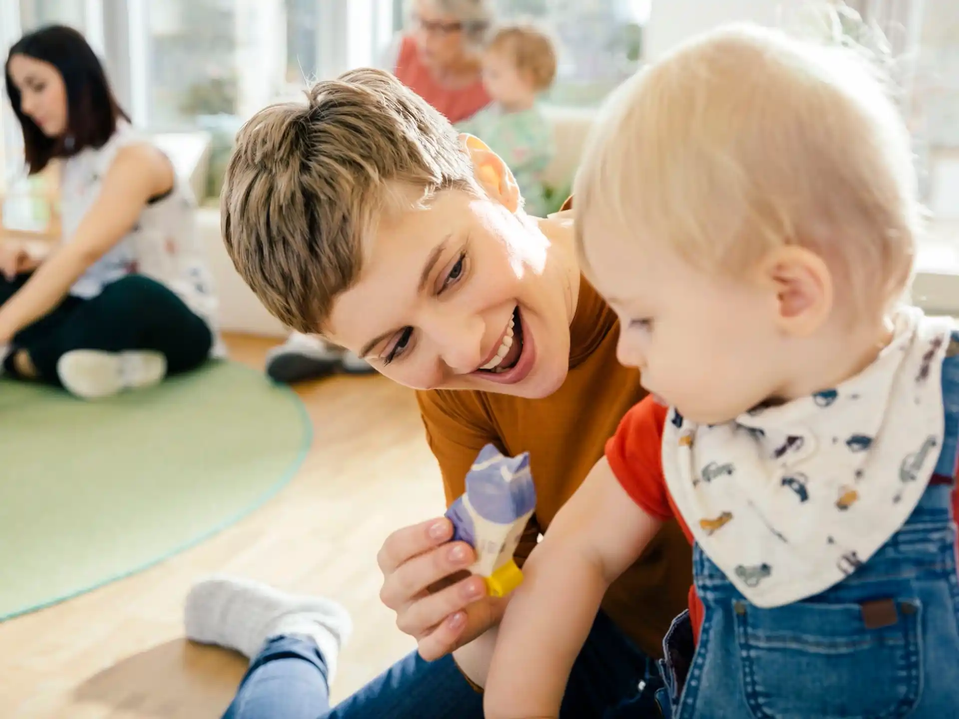 a couple of kids playing with a toy