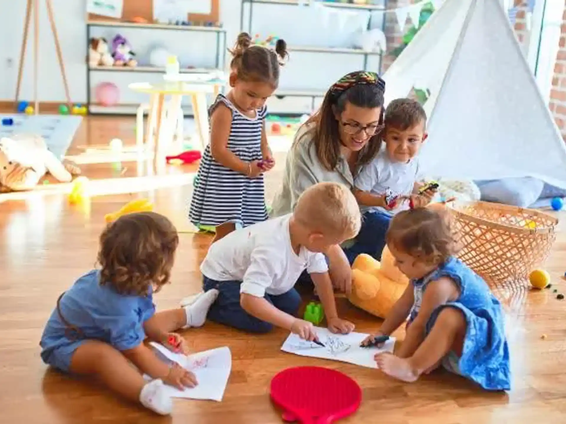 a group of children playing with toys