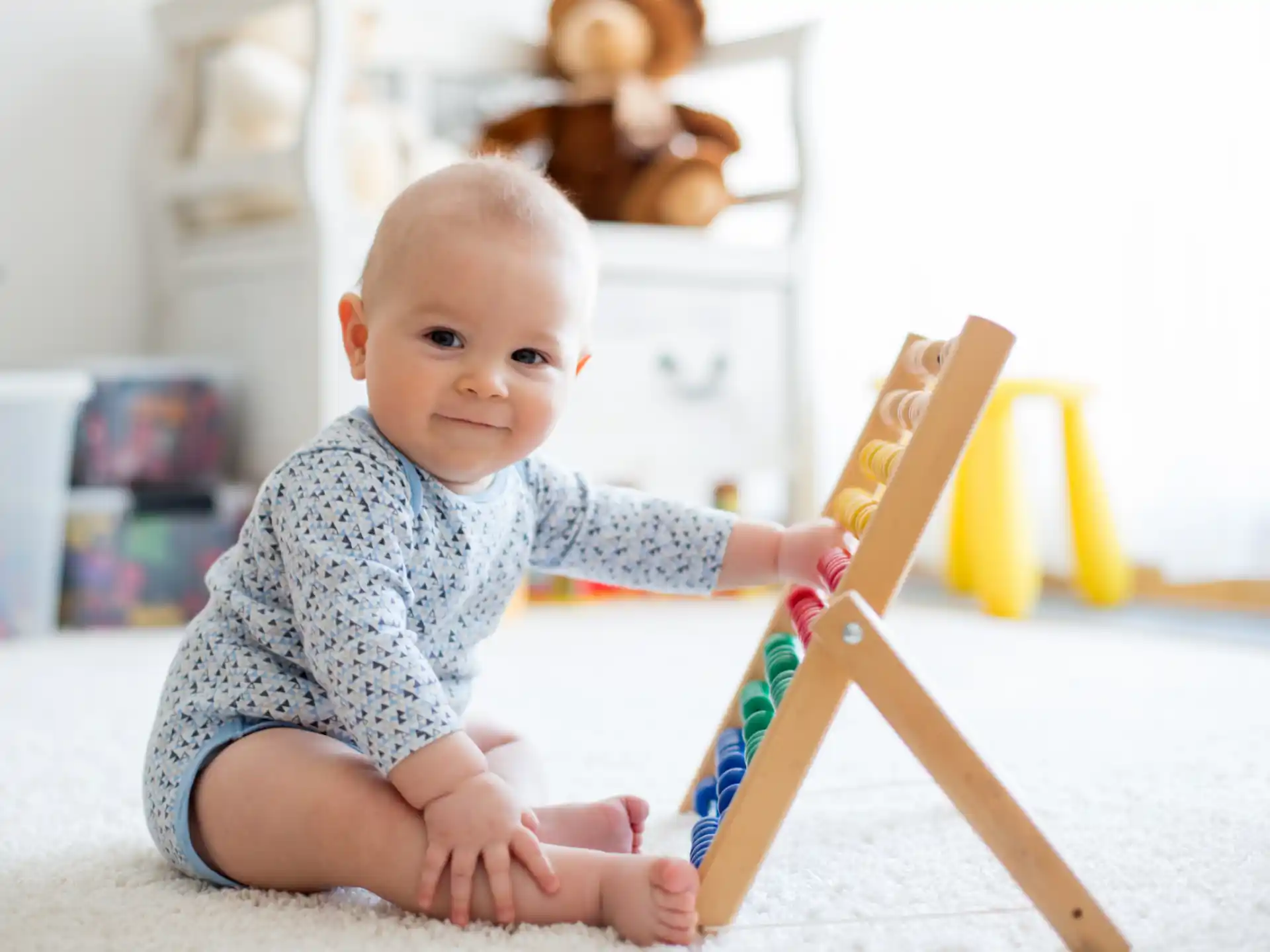 a baby sitting on the floor