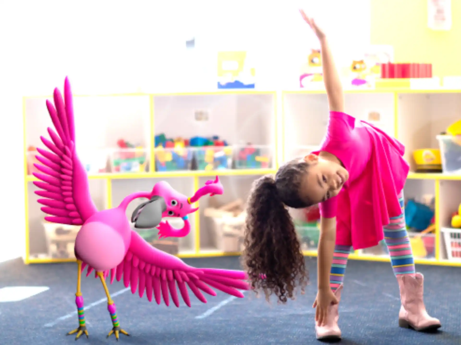 a couple of girls playing with a toy dinosaur