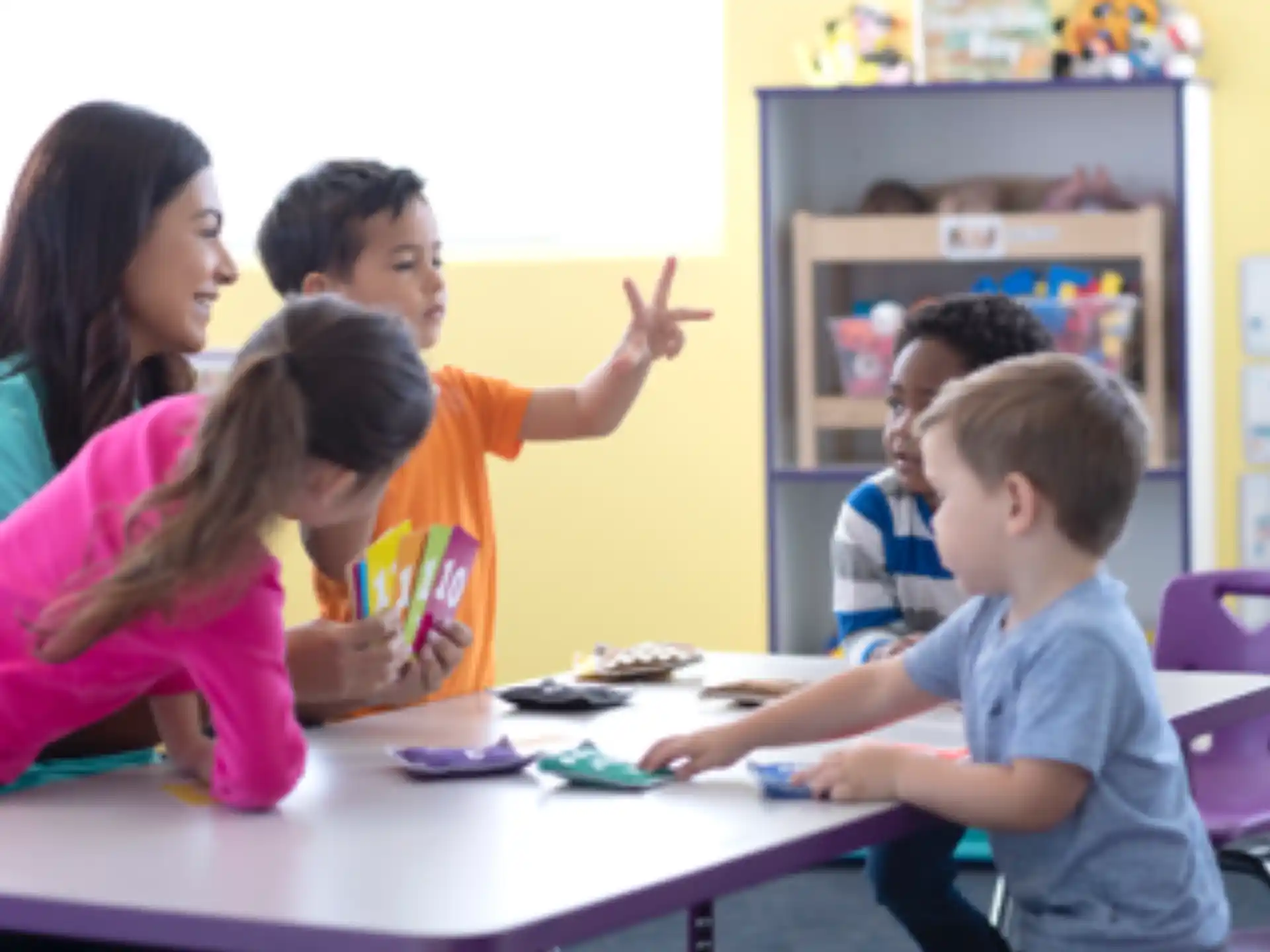 a group of children sitting at a table
