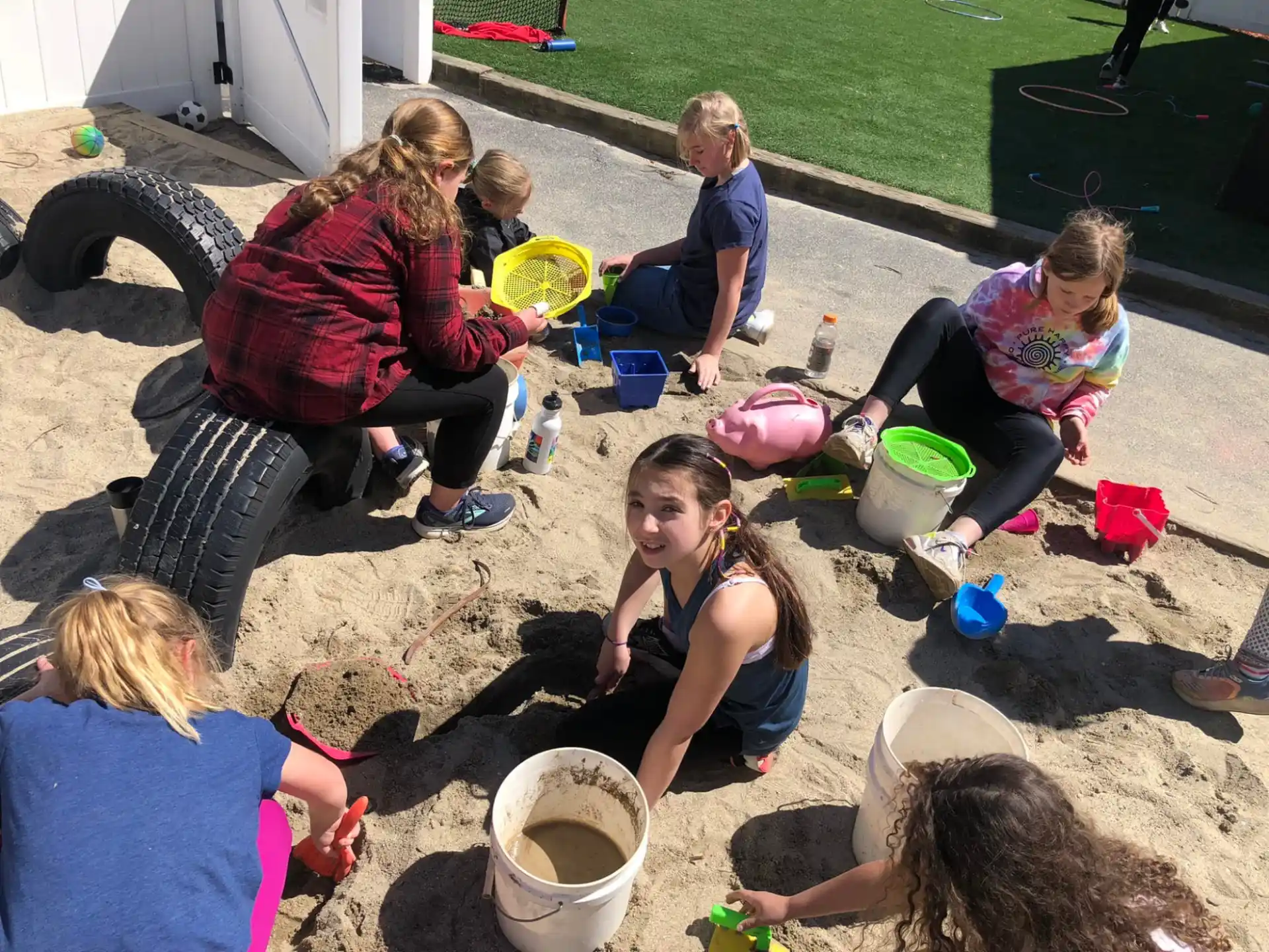 a group of people sitting on the ground