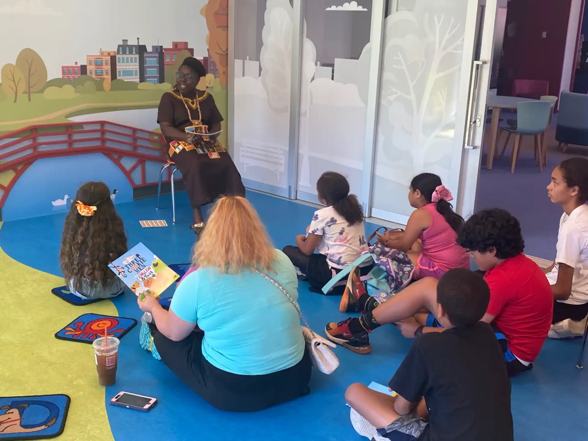 a group of people sitting on the floor playing instruments