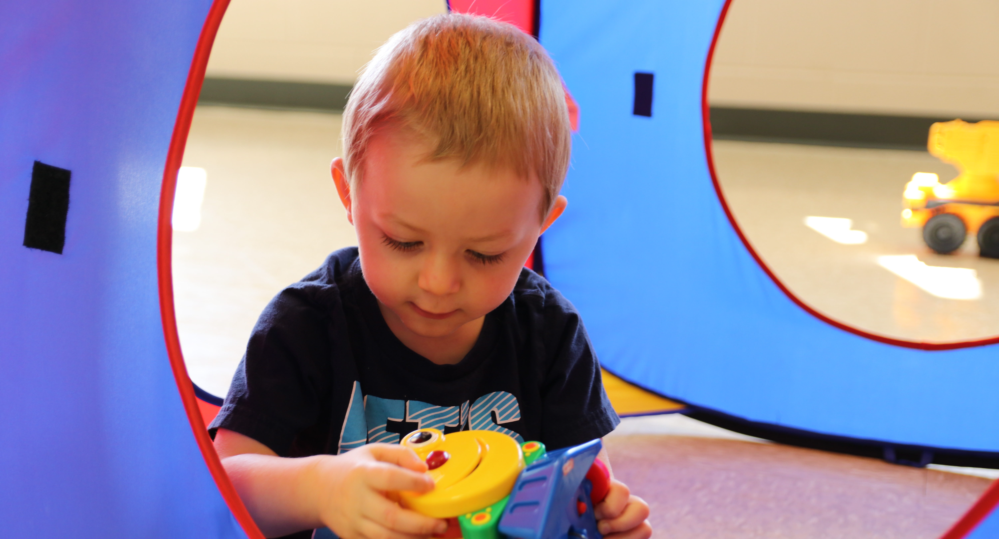 a child playing with a toy
