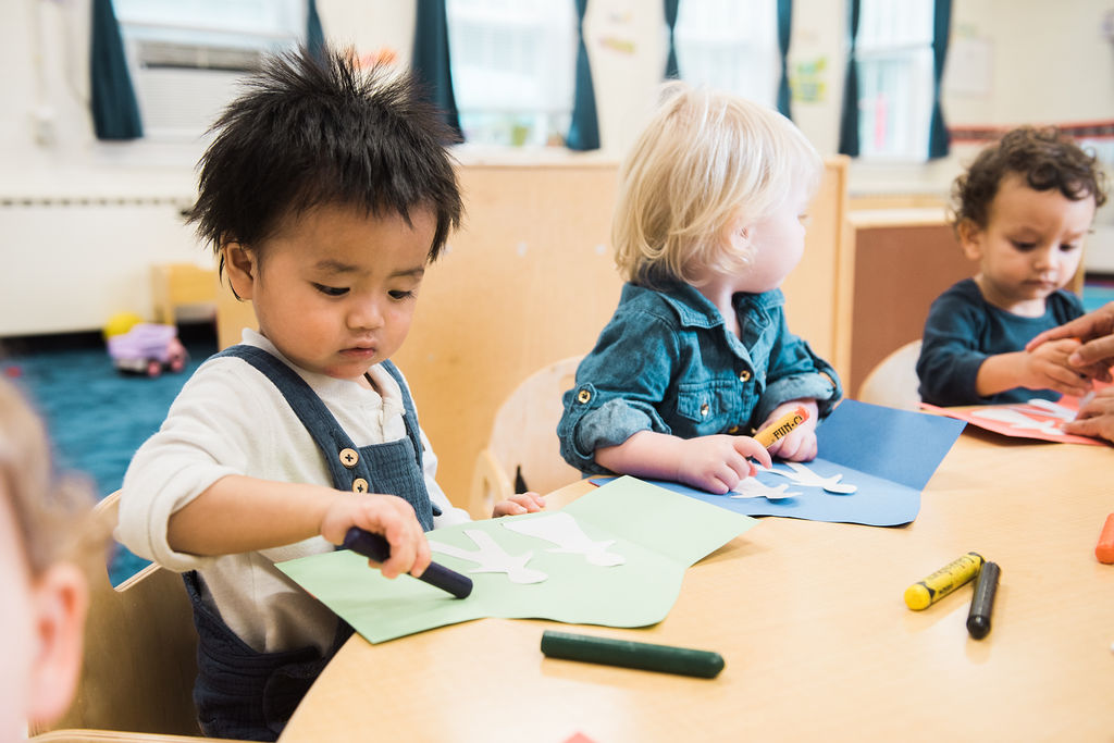 a few children sitting at a table