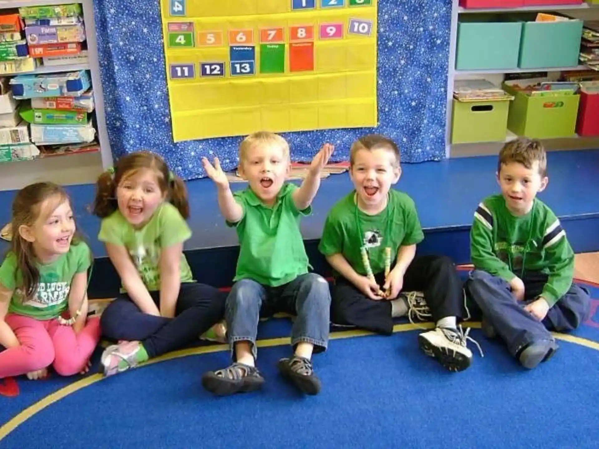 a group of children sitting on the floor