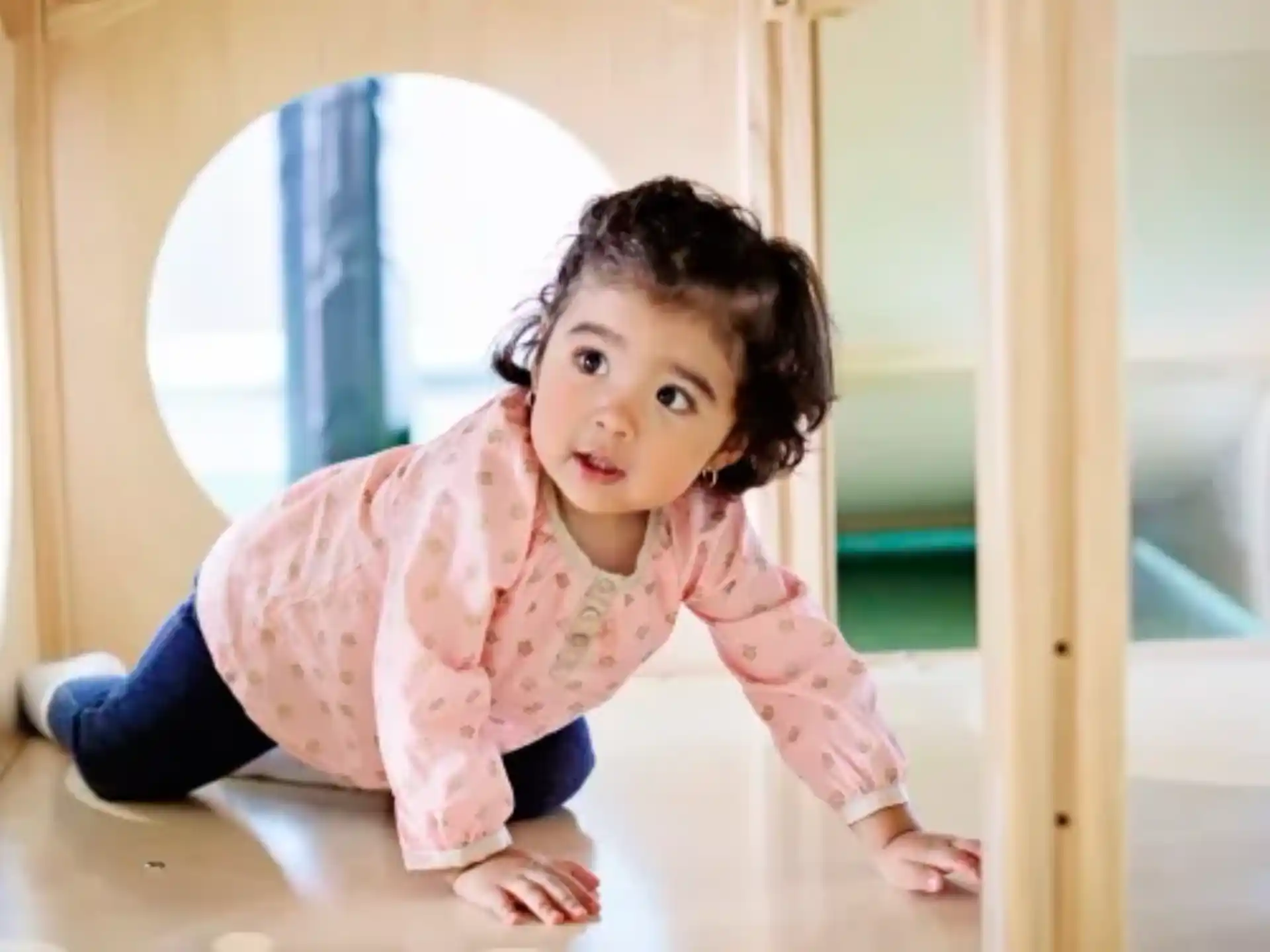 a baby crawling on a table