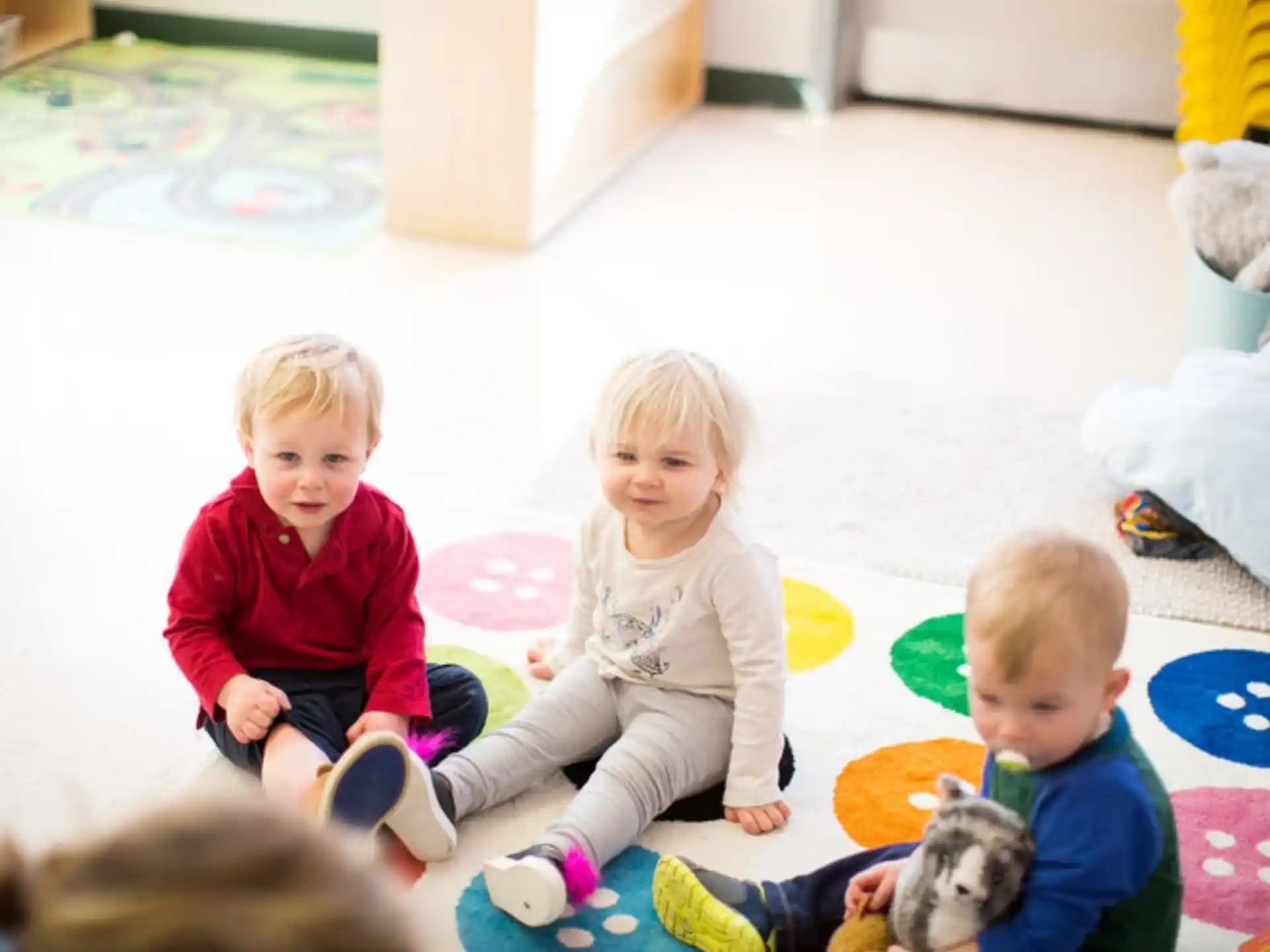 a group of children sitting on the floor