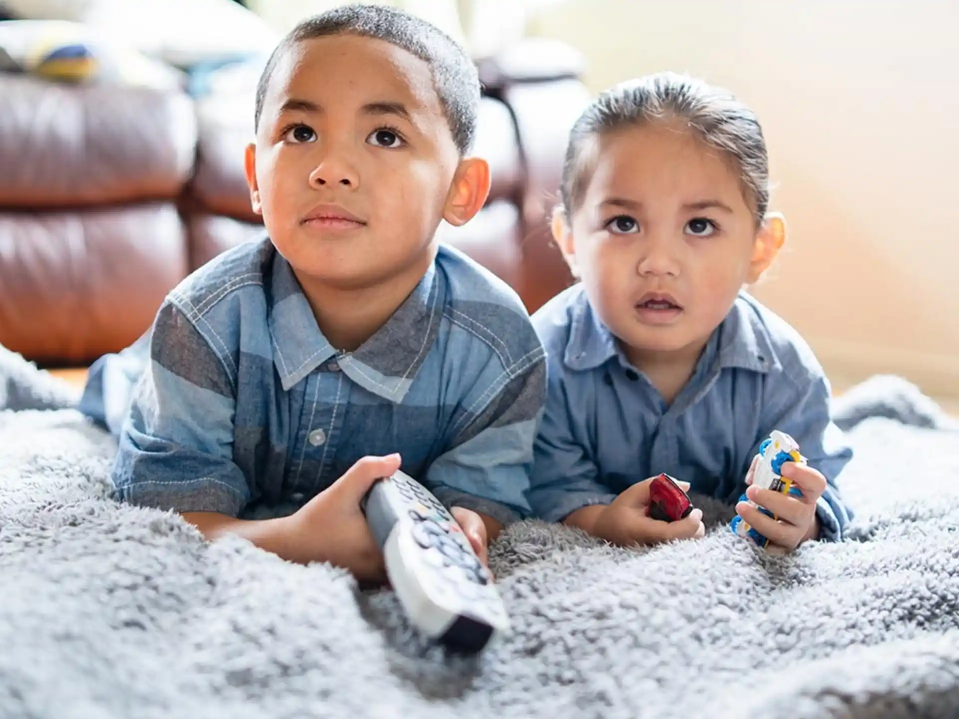 two boys playing with toys