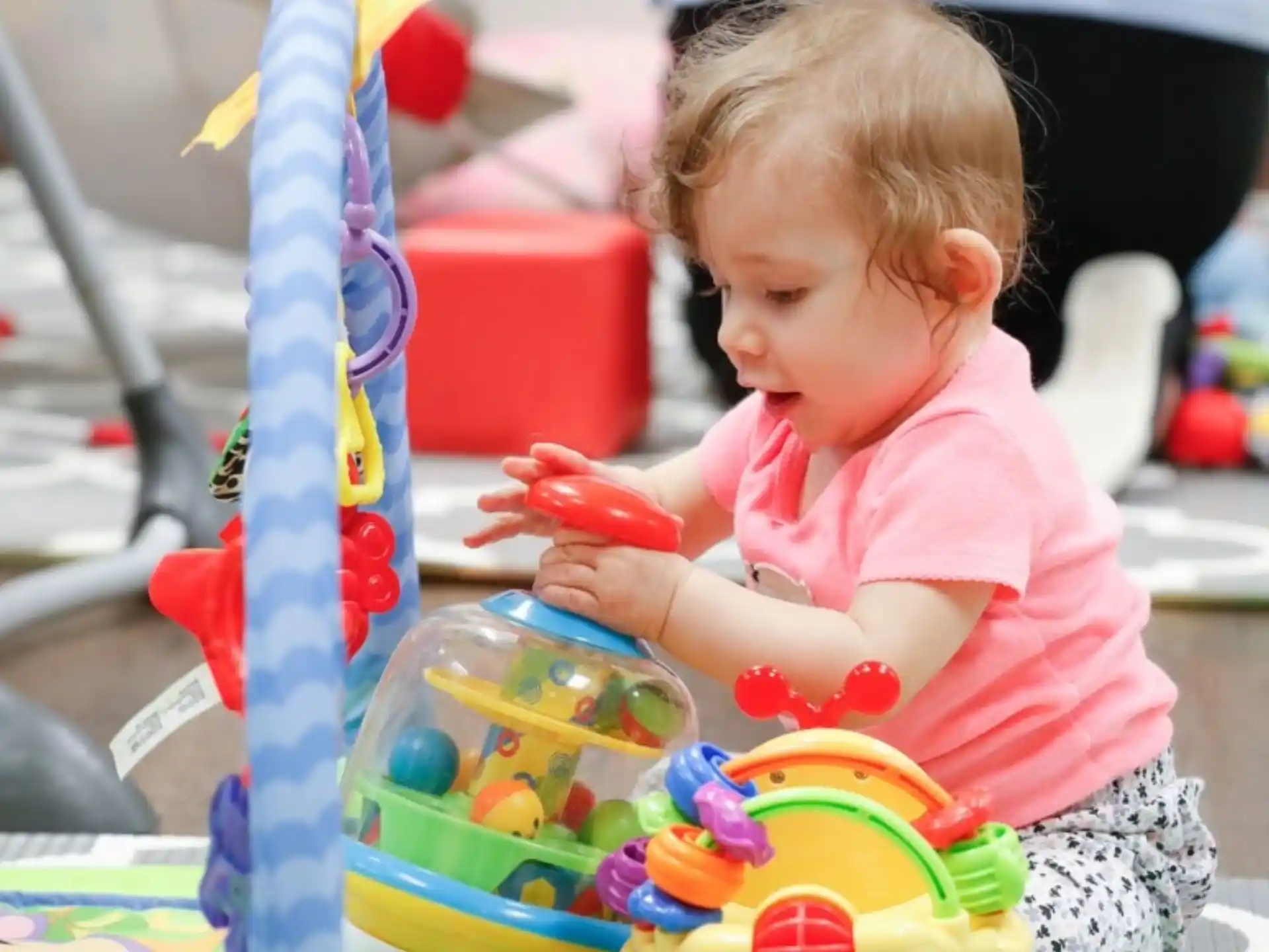 a baby playing with toys