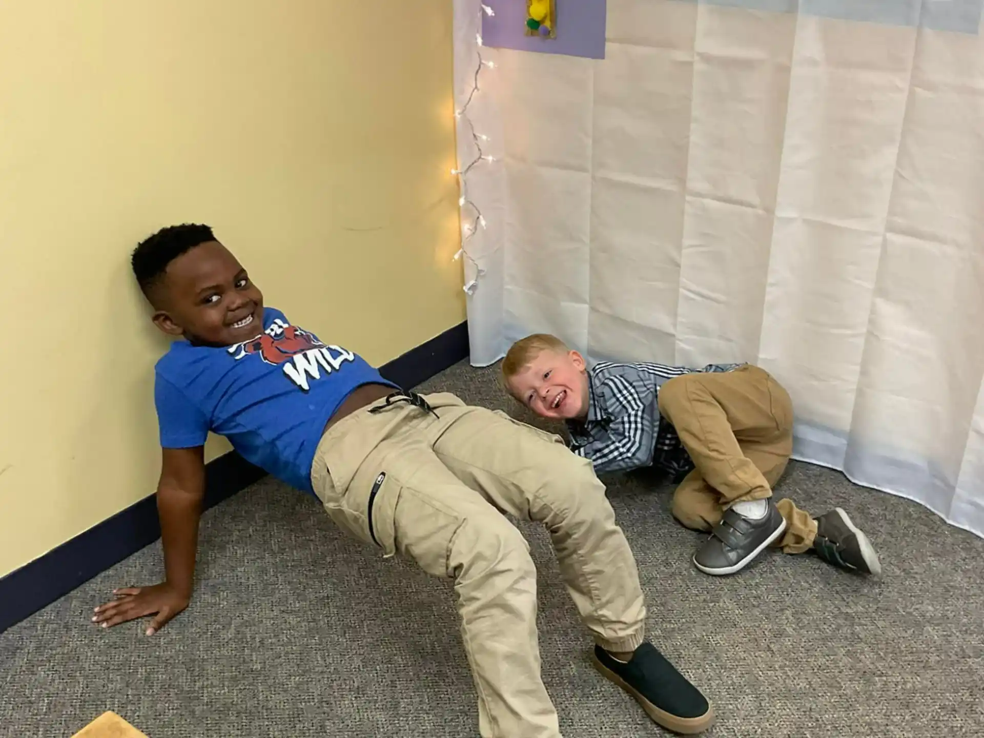 a person lying on a person's back on the floor